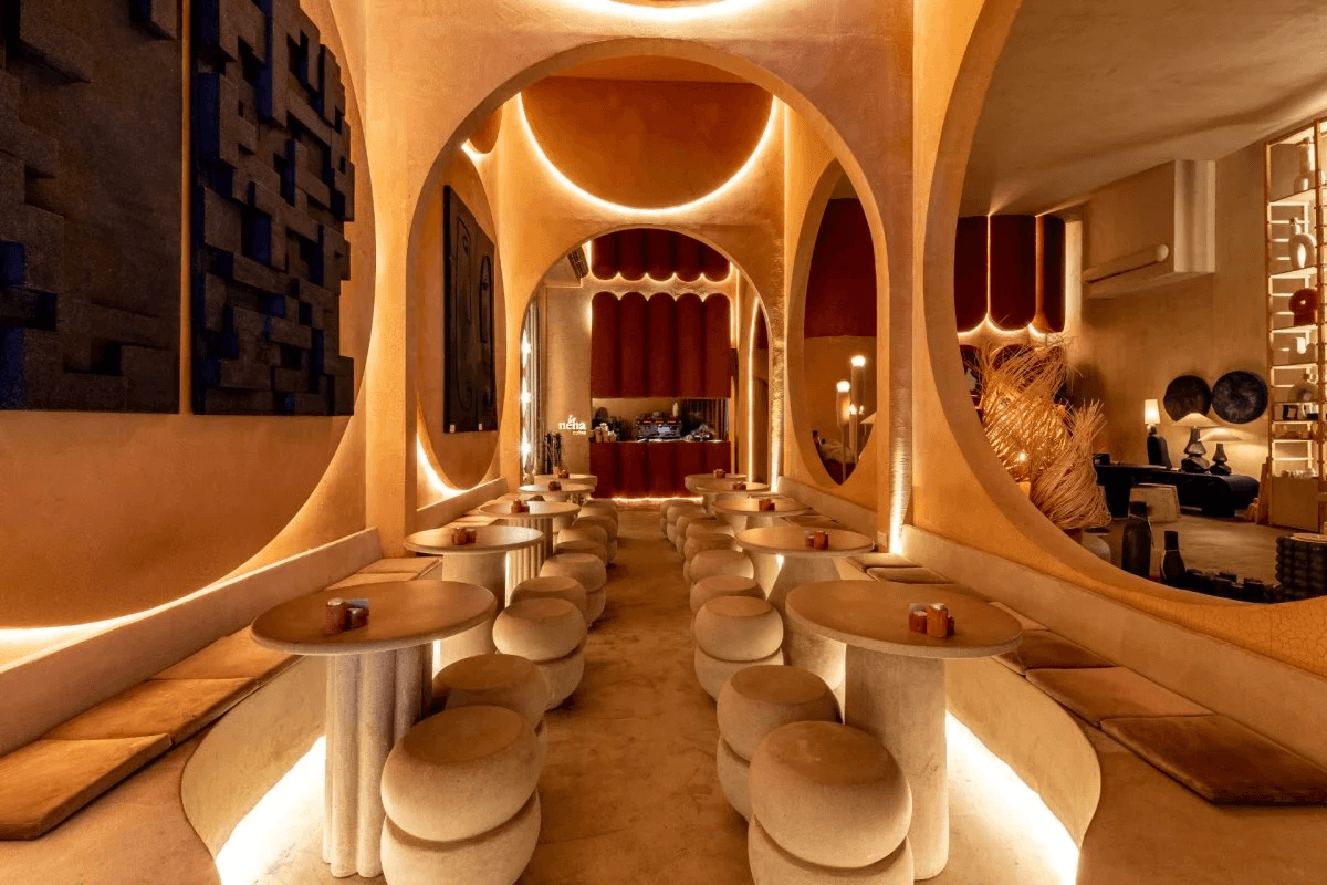 Warm-toned interior of La Nena pet-friendly restaurant with artistic lighting and sculptural décor