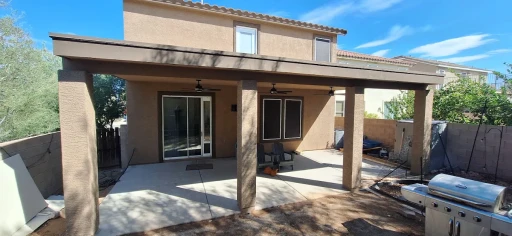 Two-story stucco home with covered patio in Tucson