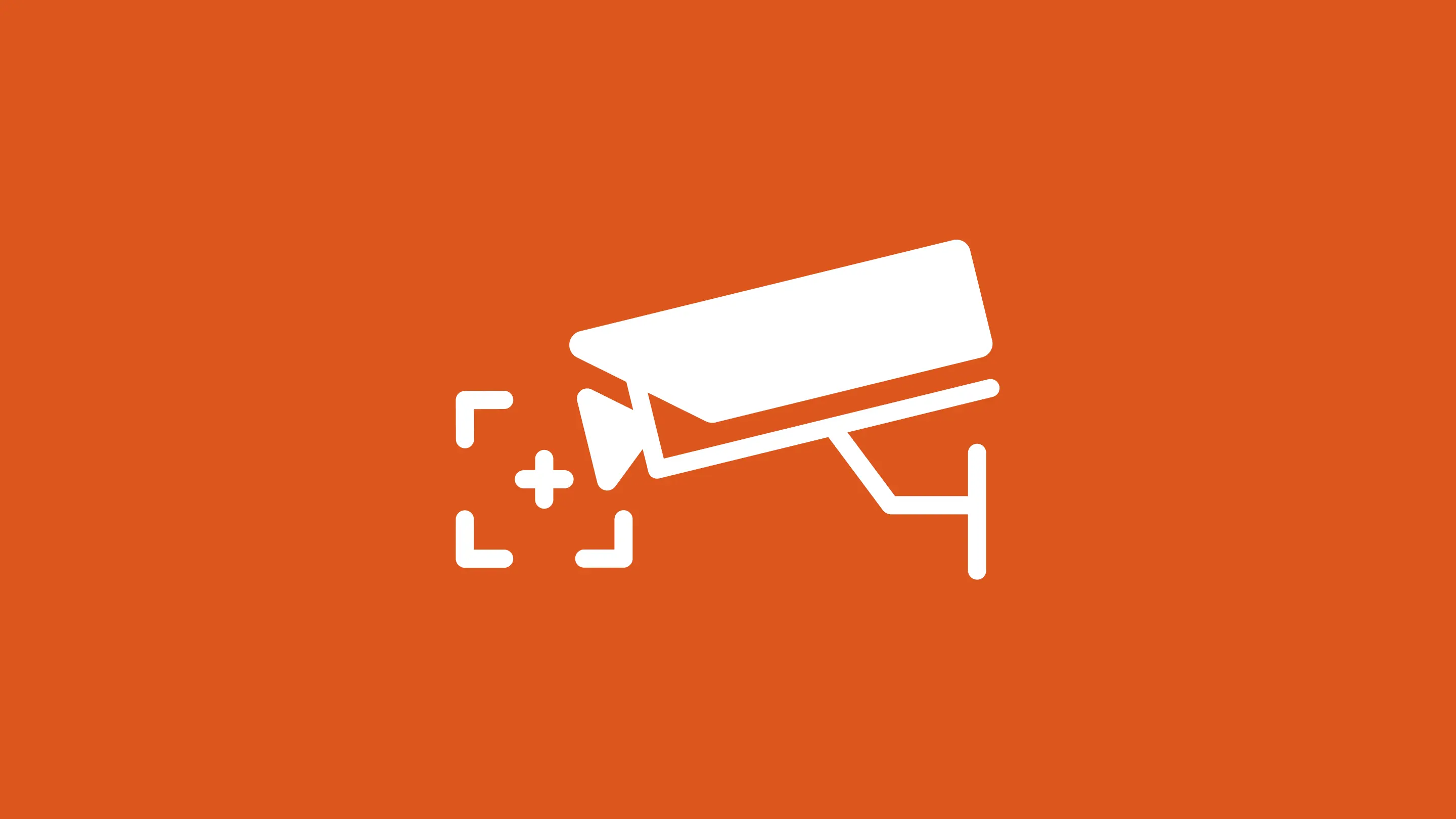 White surveillance camera pictogram with a focus marker and plus sign, shown on an orange background.