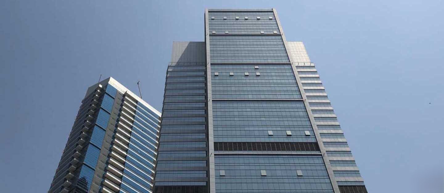 Modern glass facade of Westburry Office Tower, premium commercial real estate in Business Bay.