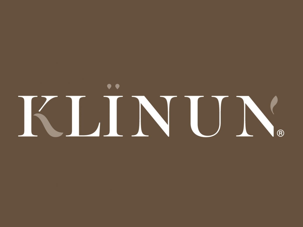 Rustic cabin in a golden field at sunset