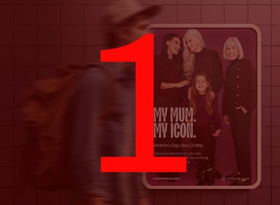 A fast black sports car races down the highway.