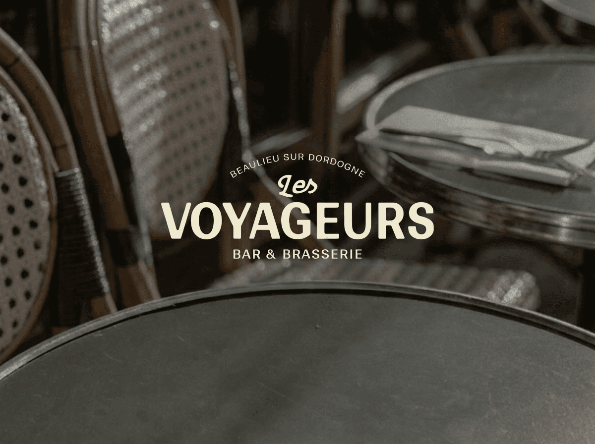 Modern home office setup with a monitor, ergonomic chair, keyboard, and indoor plants near a window with blinds.