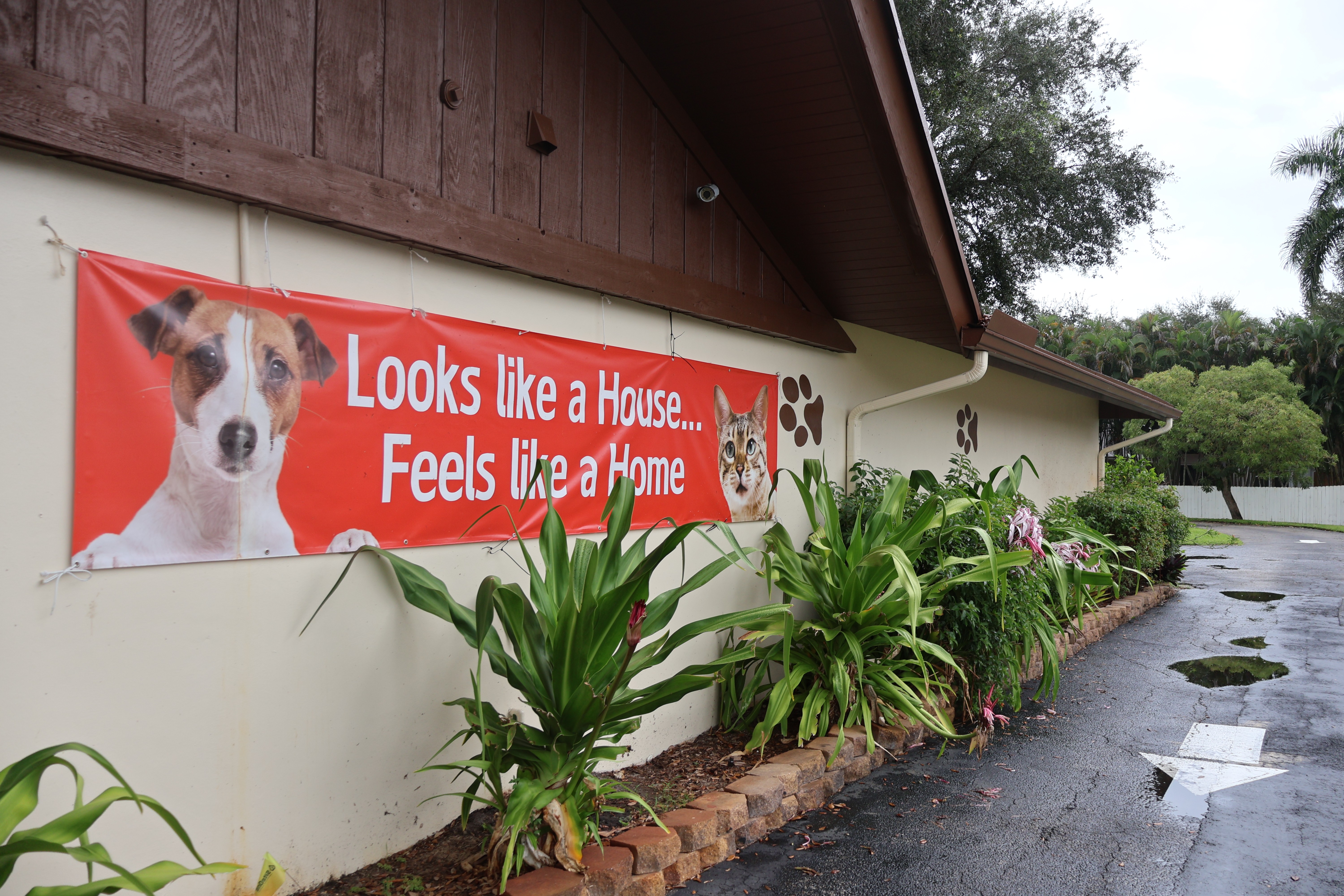 red banner on the side of the hospital that says "looks like a house...feels like a home"