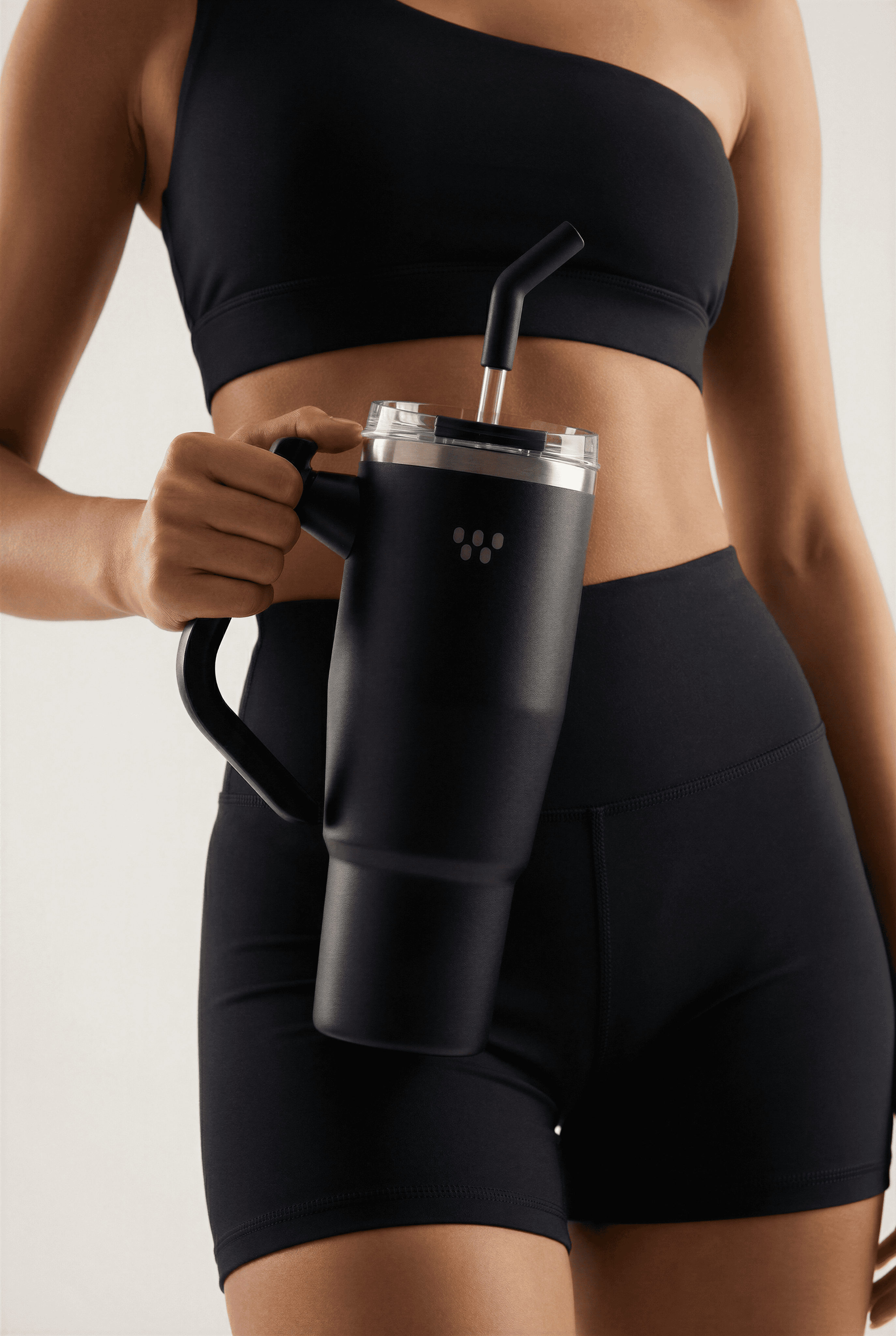 man sitting on gray concrete wall