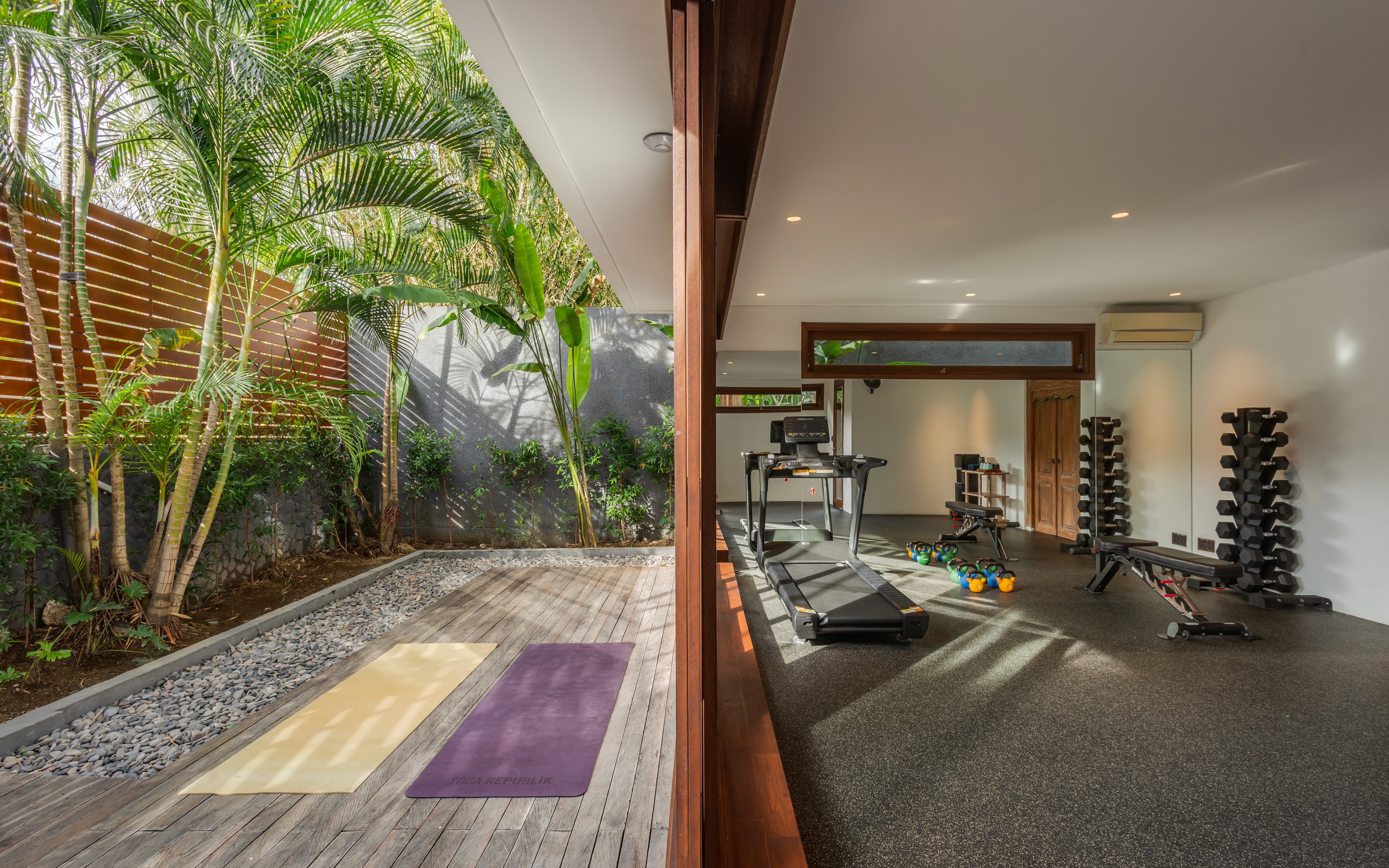 Modern hillside home with terracotta urn and mountain view