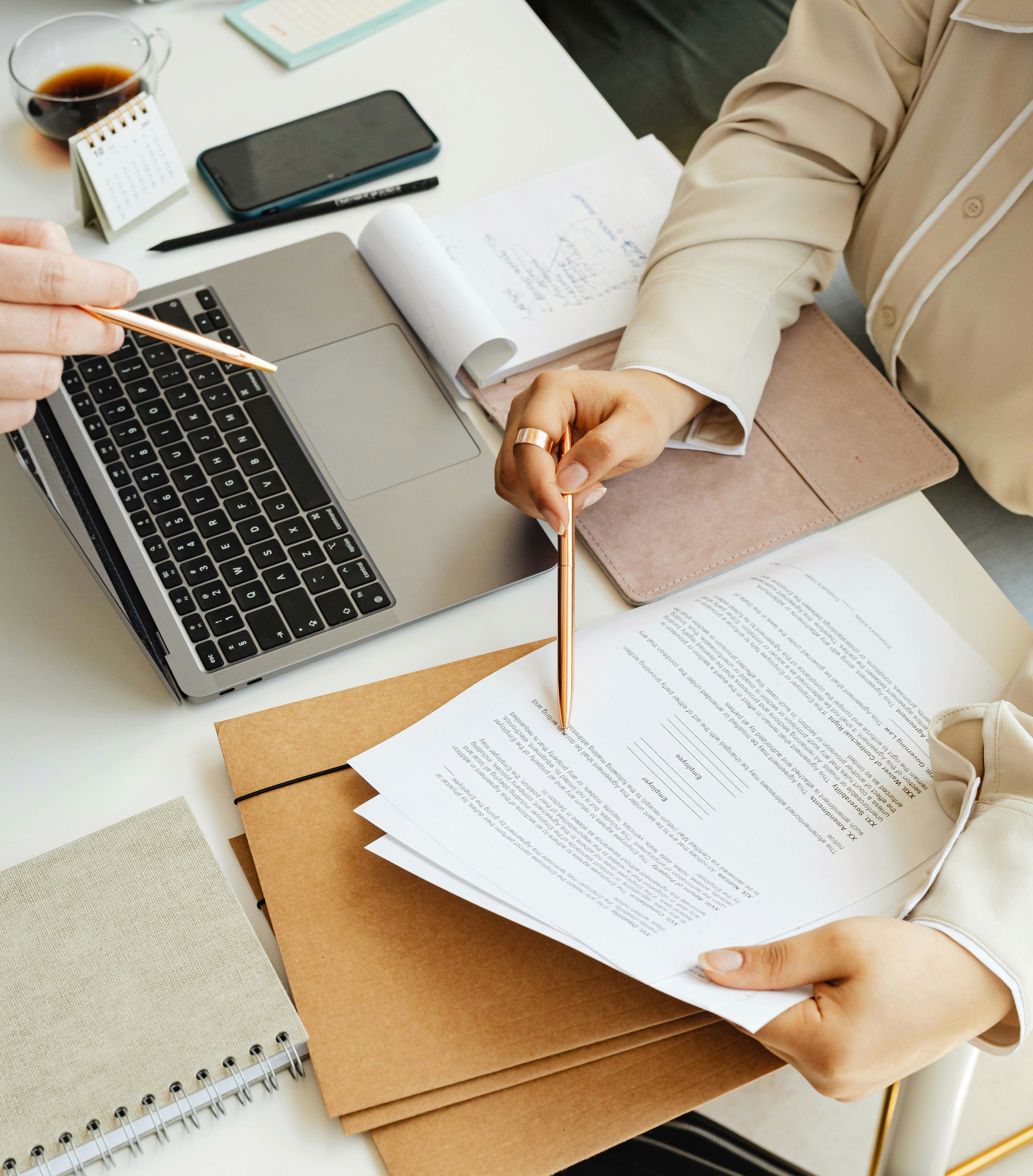 two people looking at a tablet and smiling