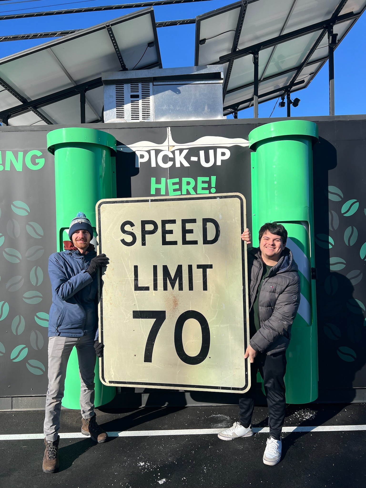 Fun Team Photo Holding Speed limit sign
