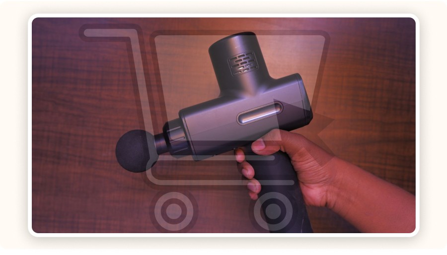 hand holding massage gun