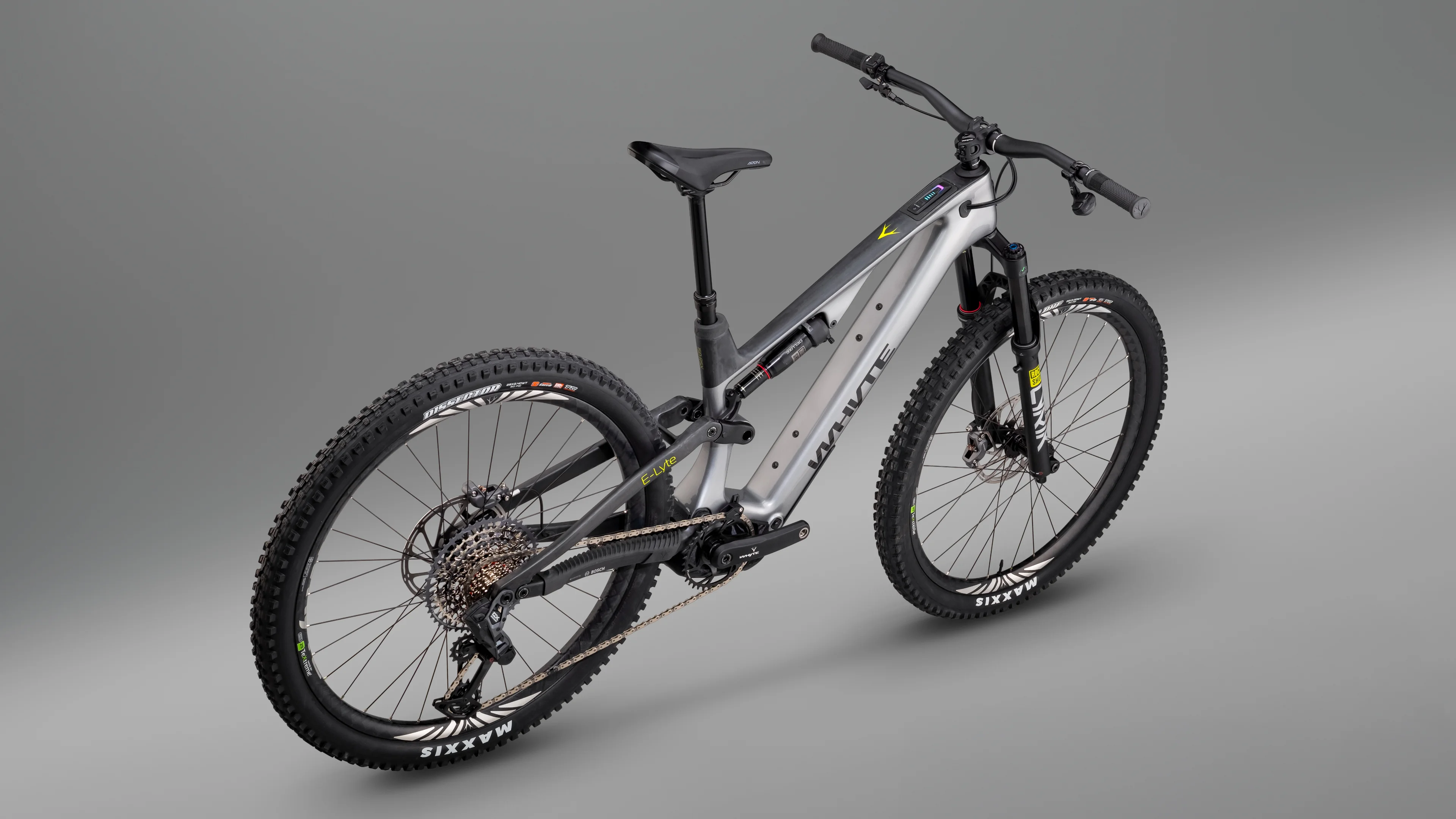 Three-quarter studio view of Elyte electric mountain bike highlighting geometry, integrated motor system, and lightweight carbon frame design.
