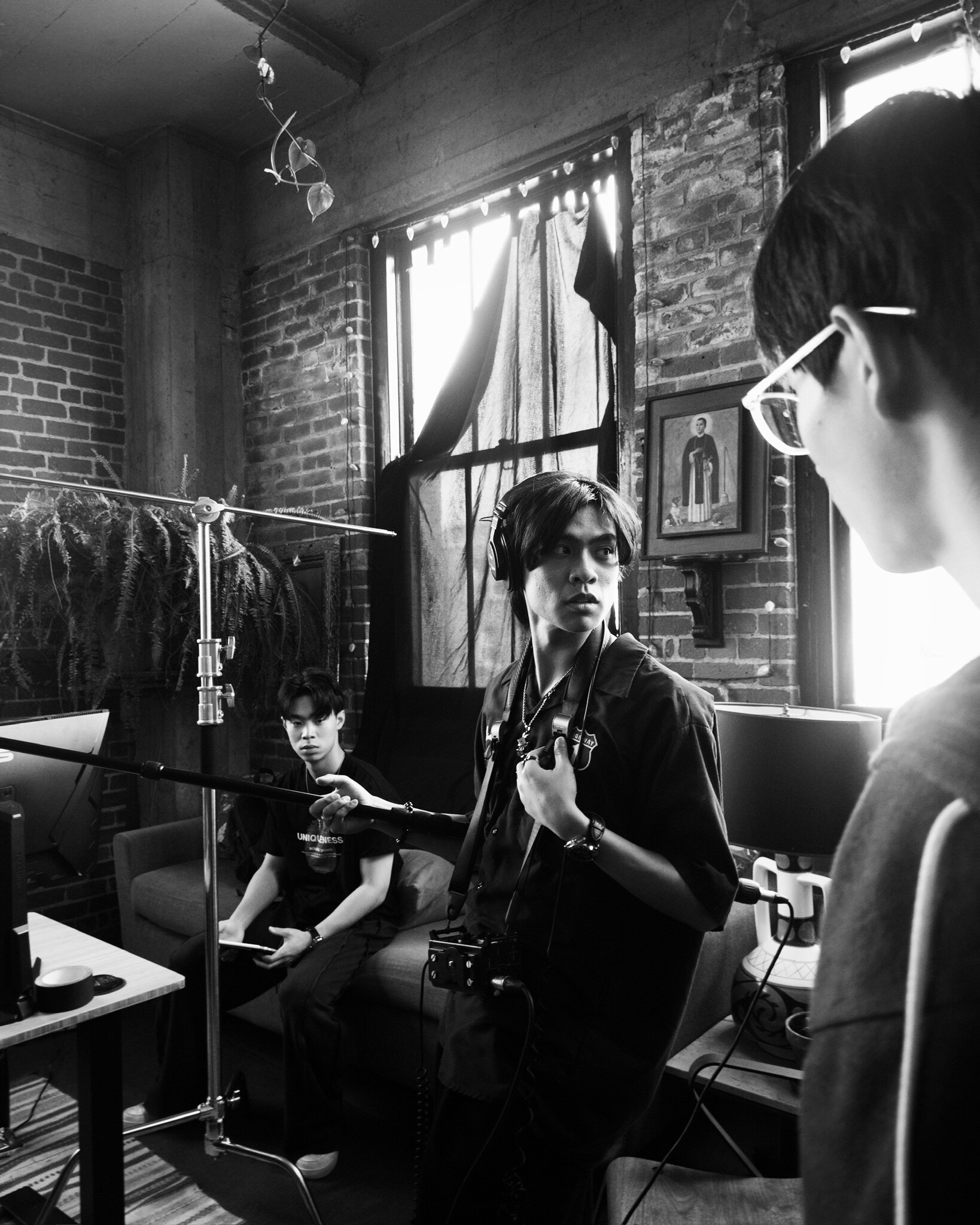 Tree branches reach towards a clear, blue sky.