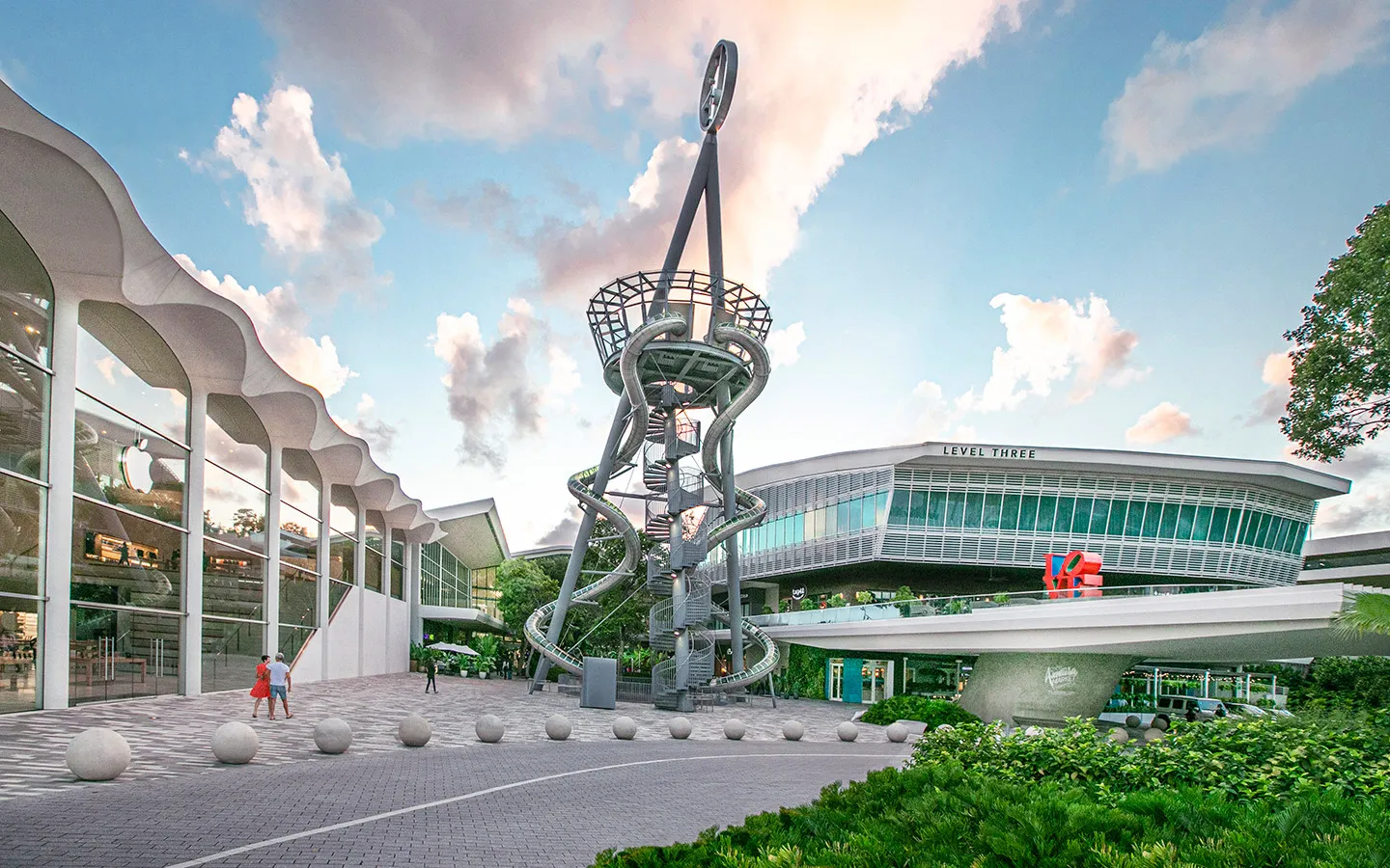 A group of people praticing yoga on the beach in the morning
