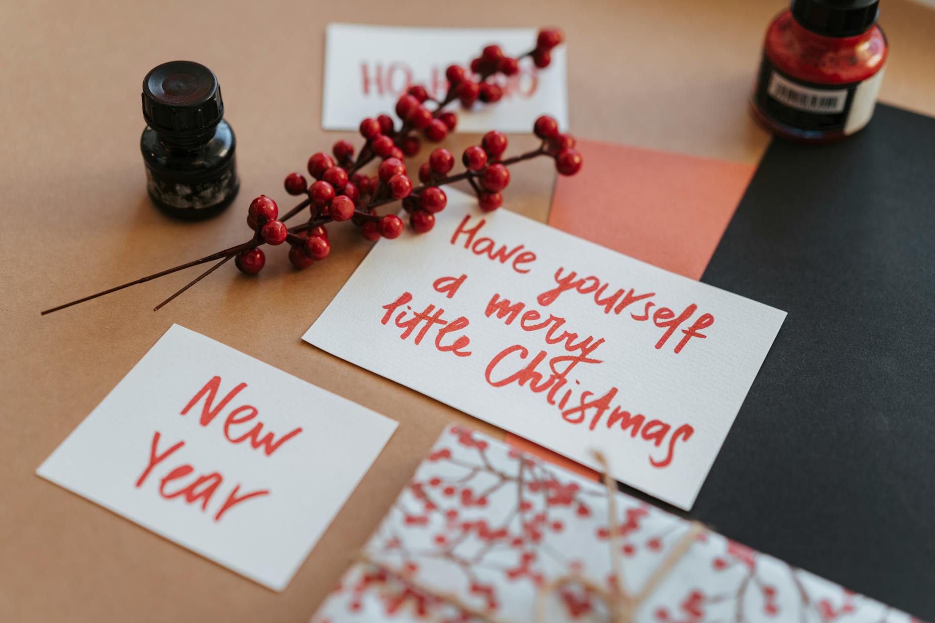 Festive Christmas and New Year cards with holiday decorations and calligraphy.