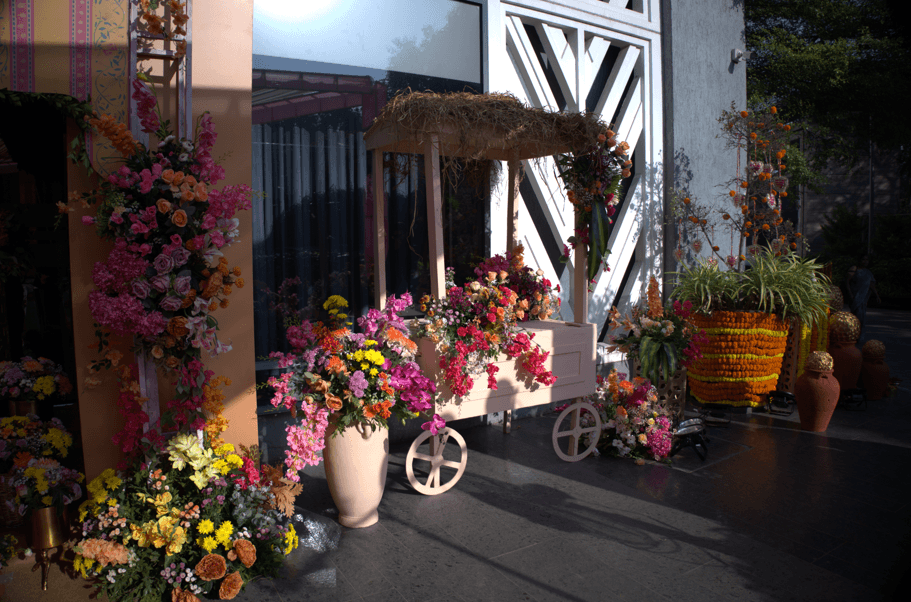 A couple stands outdoors at sunset.