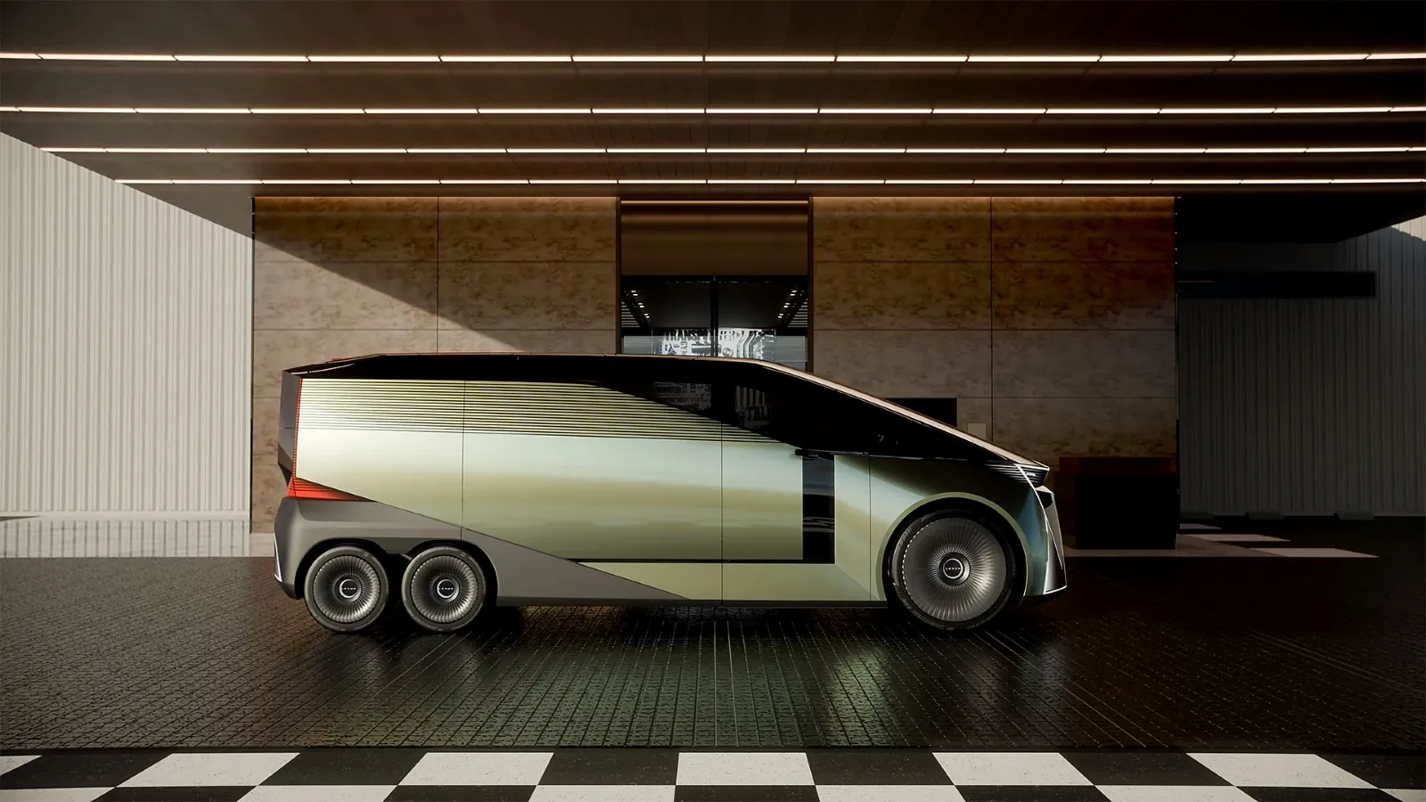 A sleek, futuristic electric concept vehicle with a tri-axle design is parked inside a modern showroom with industrial lighting and a checked floor.