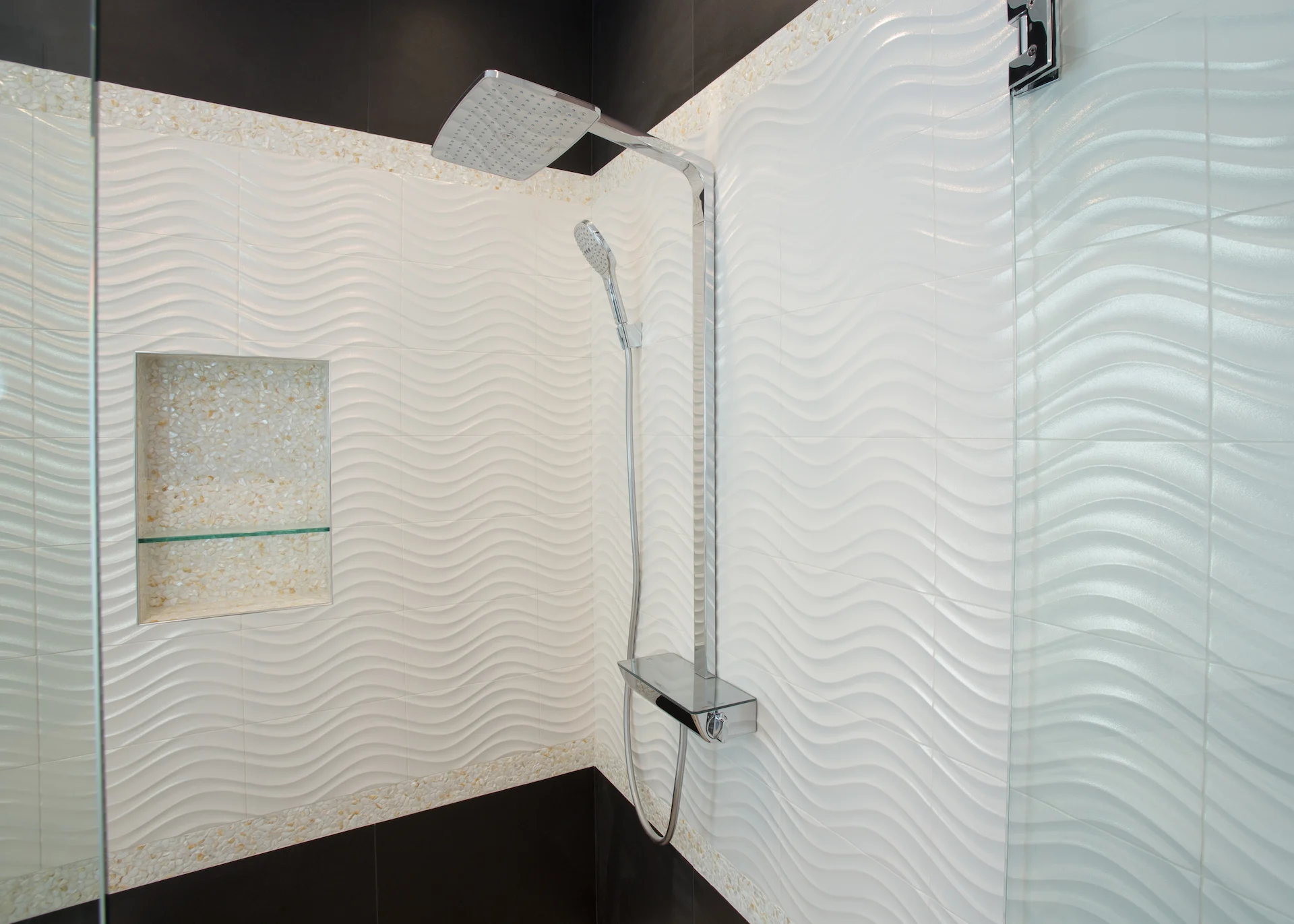 Closeup of the master shower head, emphasizing the attention to detail and modern fixtures in this luxurious Newport Beach bathroom.