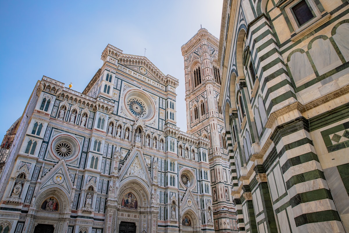 Brunelleschi's Duomo dome and bell tower rising above Florence rooftops, the walkable historic center