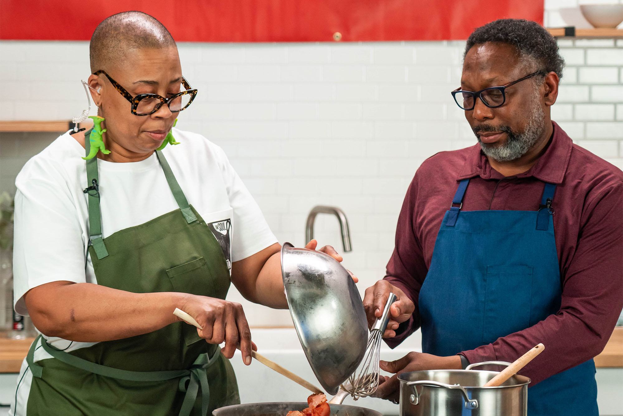 Chef Kristi Brown and chef Wayne Johnson prepare a meal for camera in the studio kitchen at Particle Studio in Seattle, WA.