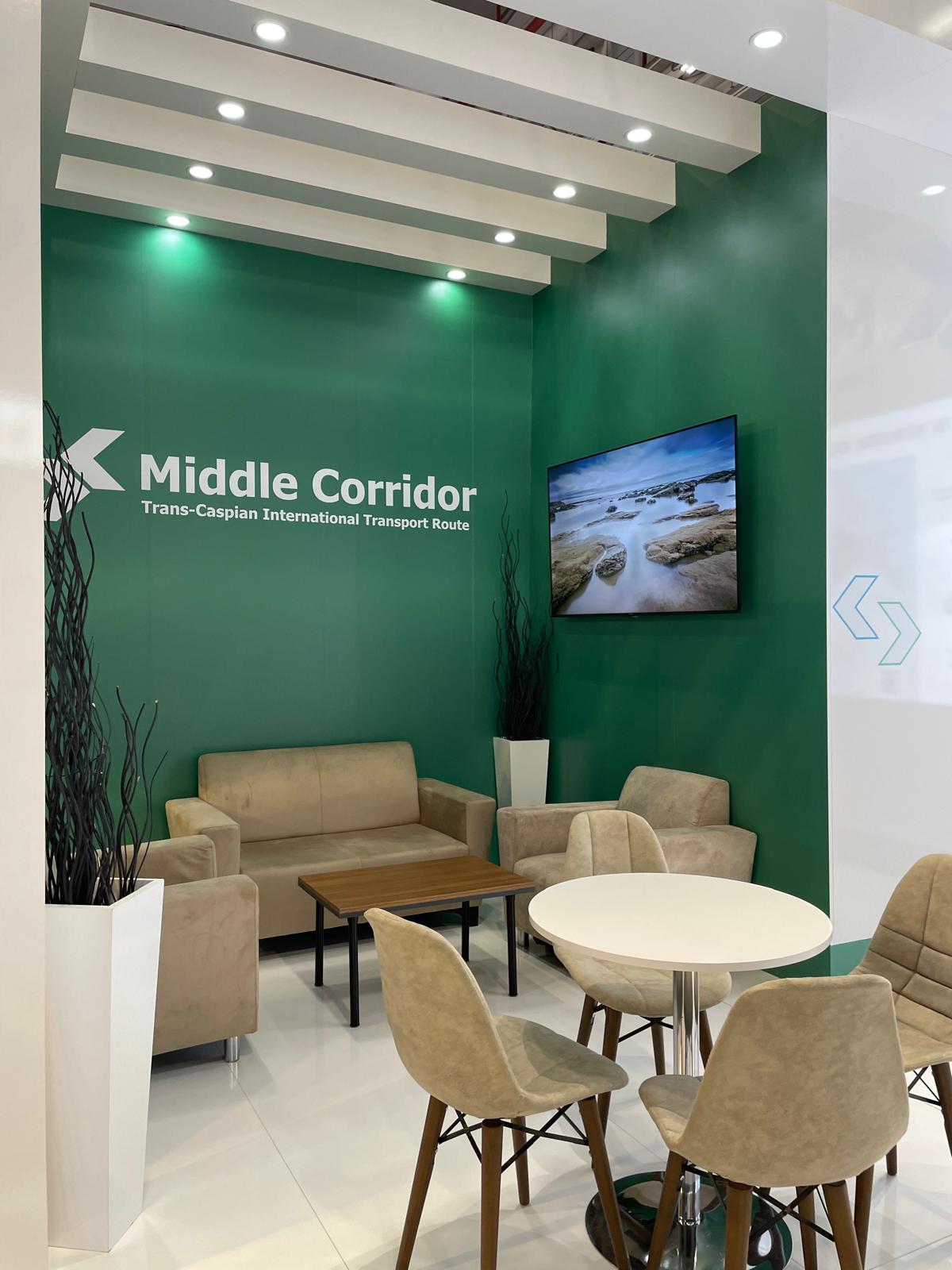 Comfortable lounge seating area at the Middle Corridor stand, designed for business discussions and visitor networking.