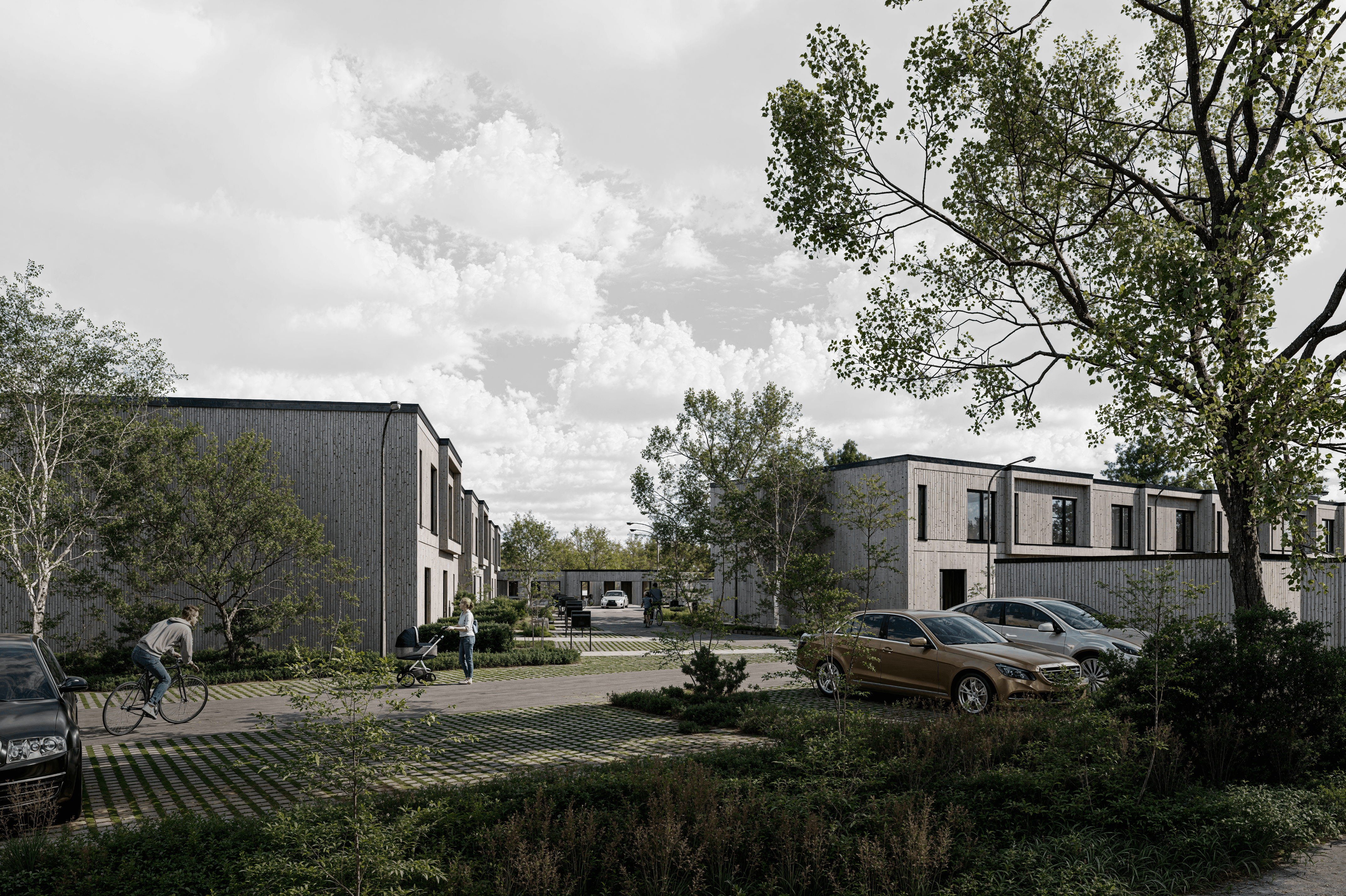 Modern glass building with illuminated facade and trees at sunset