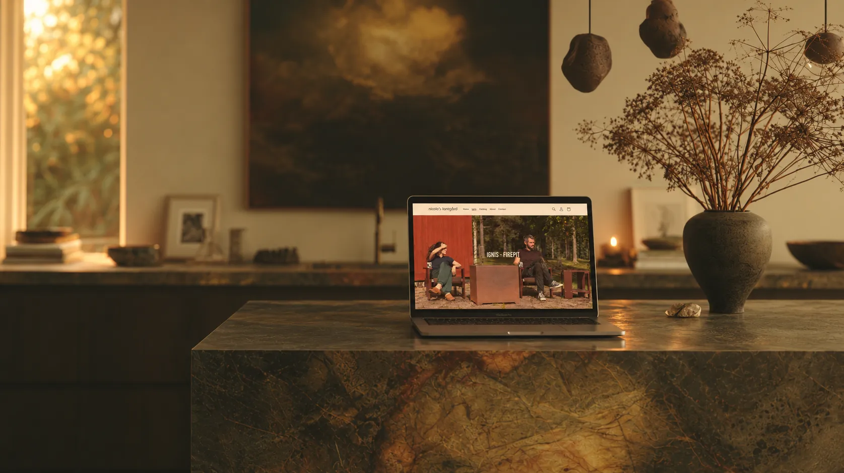 Nicole’s Lantgård website displayed on a laptop in a warm, curated interior featuring the Ignis fire pit collection.