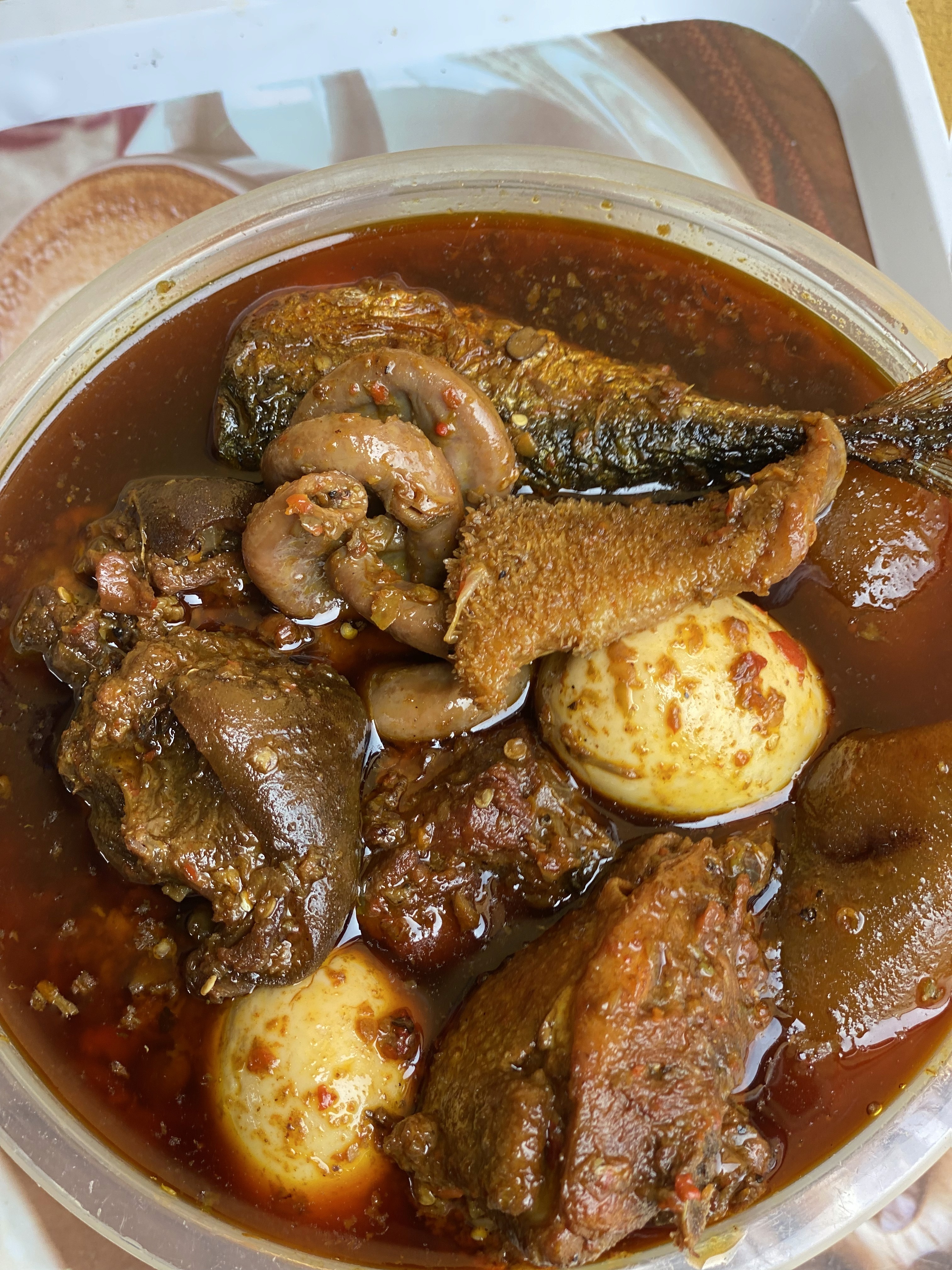 Assorted meat parts in stew bowl