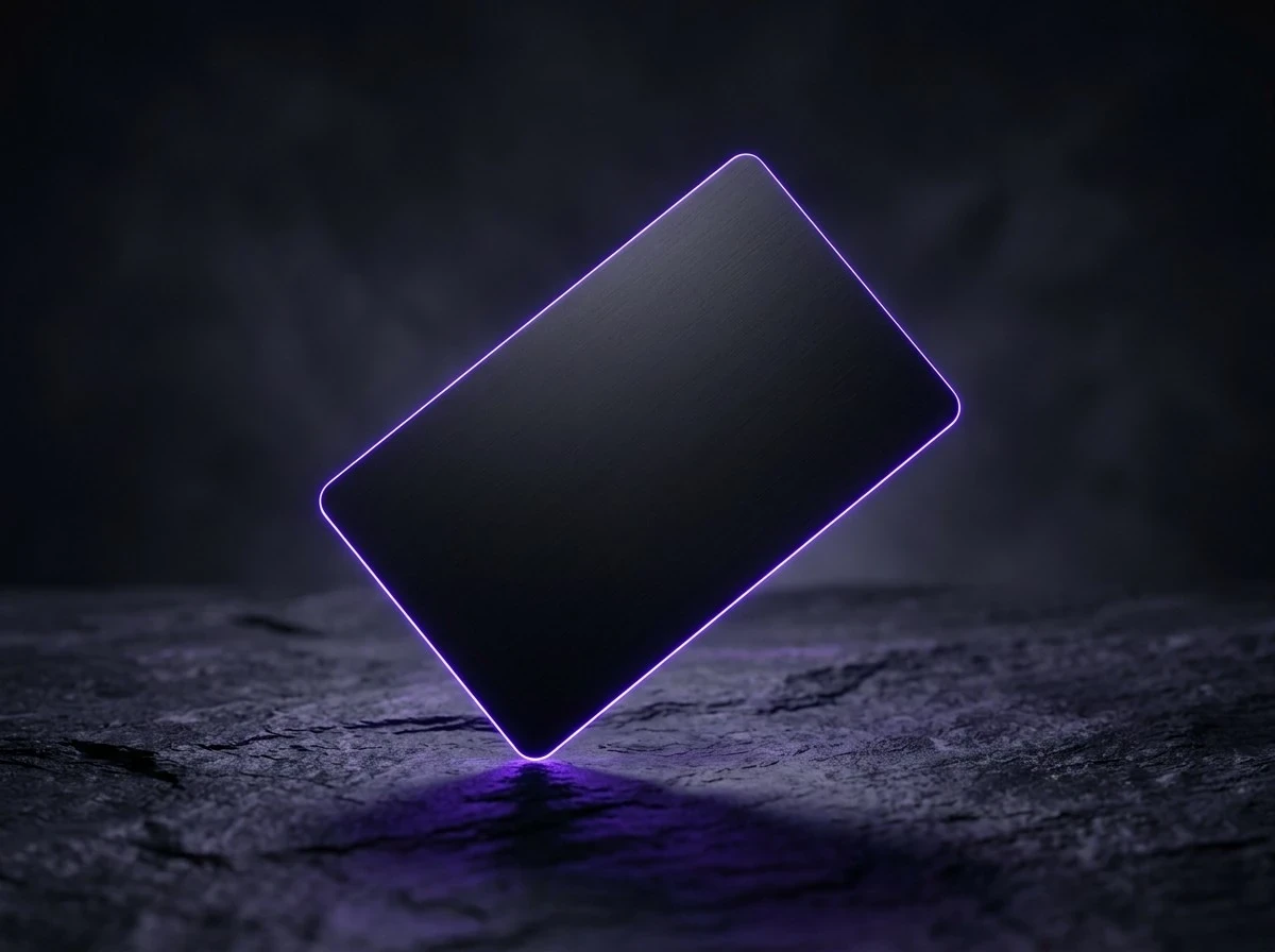 Oriel Pay card: a black card with a glowing violet edge on dark stone