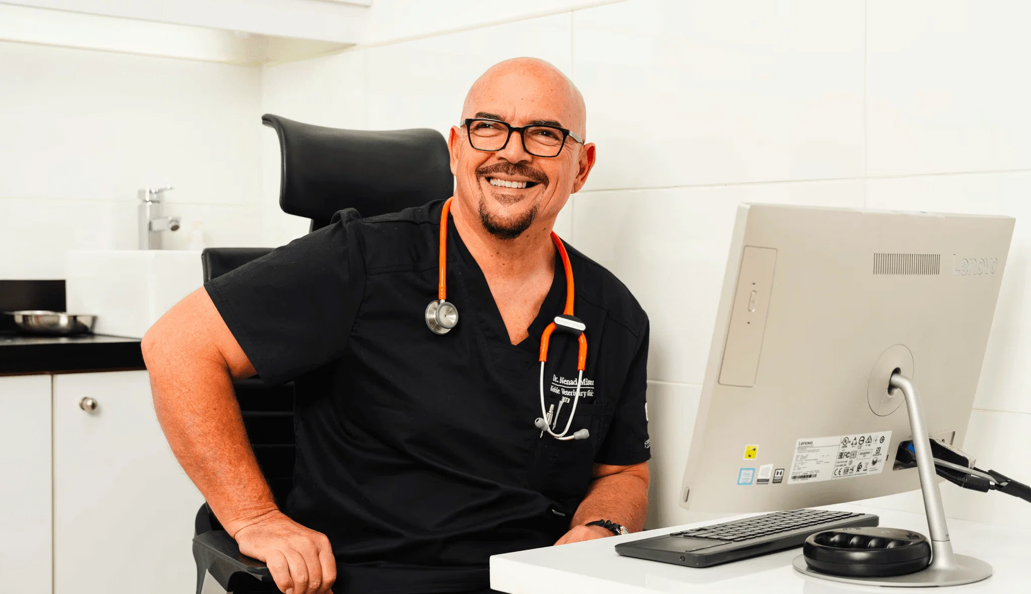 A veterinary specialist gets ready for a virtual vet visit with a pet patient.