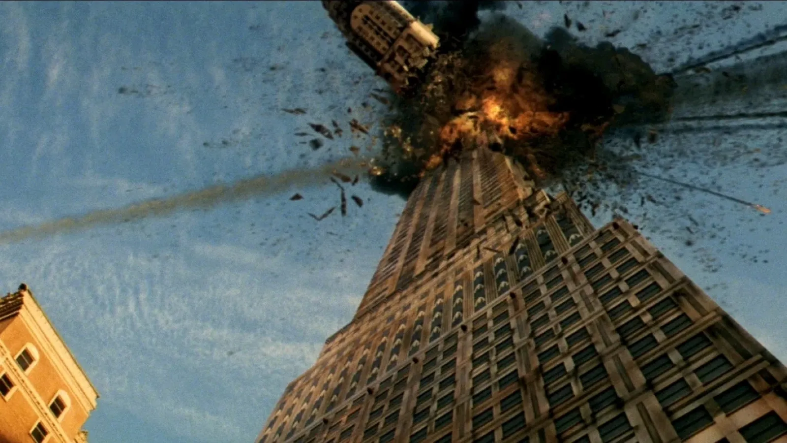 A towering skyscraper is collapsing from a Meteor impact in dramatic fashion, with debris and smoke billowing into the blue sky, capturing the chaos and intensity of a major disaster.