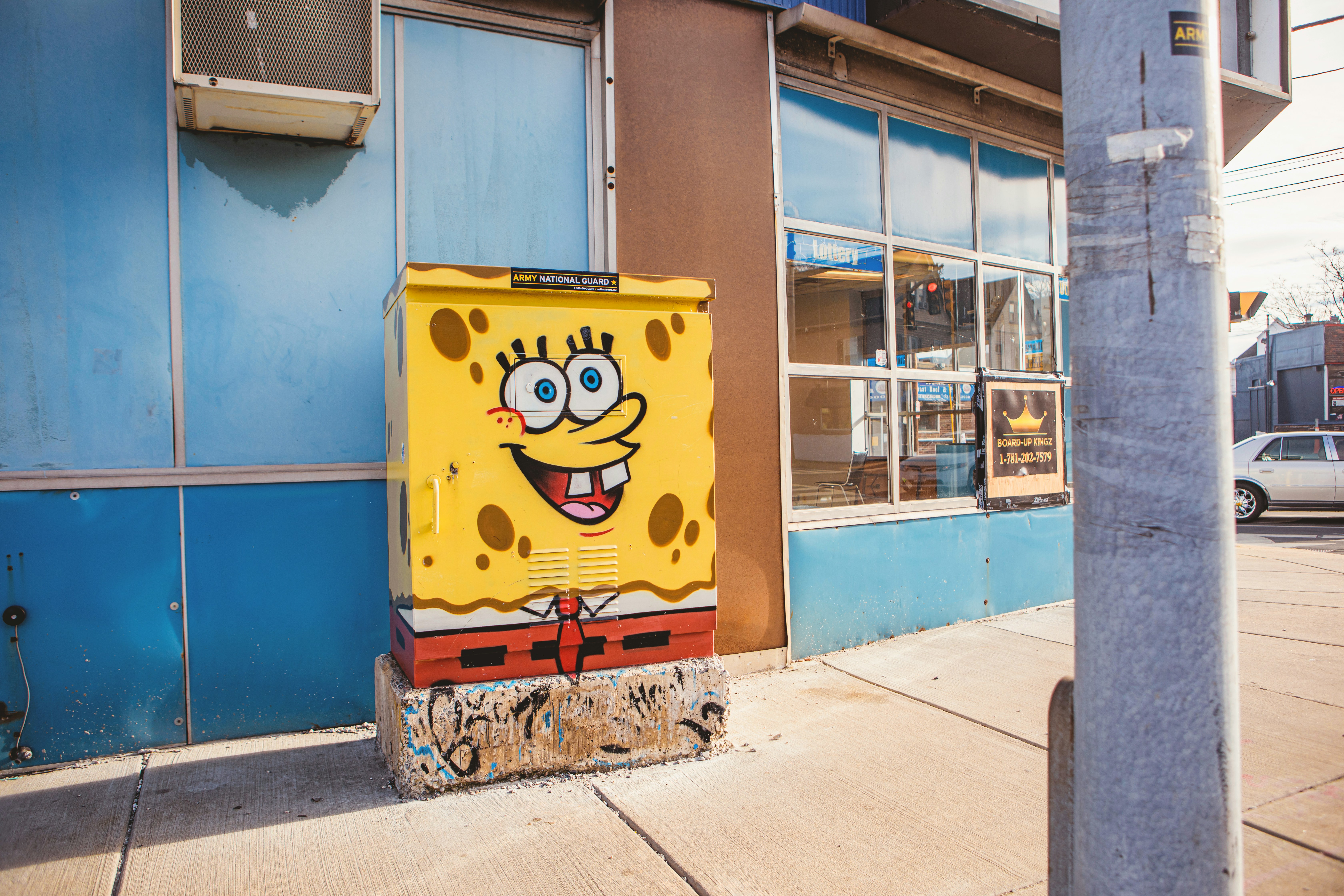 spongebob statue on a sidewalk - spongebob voice generator