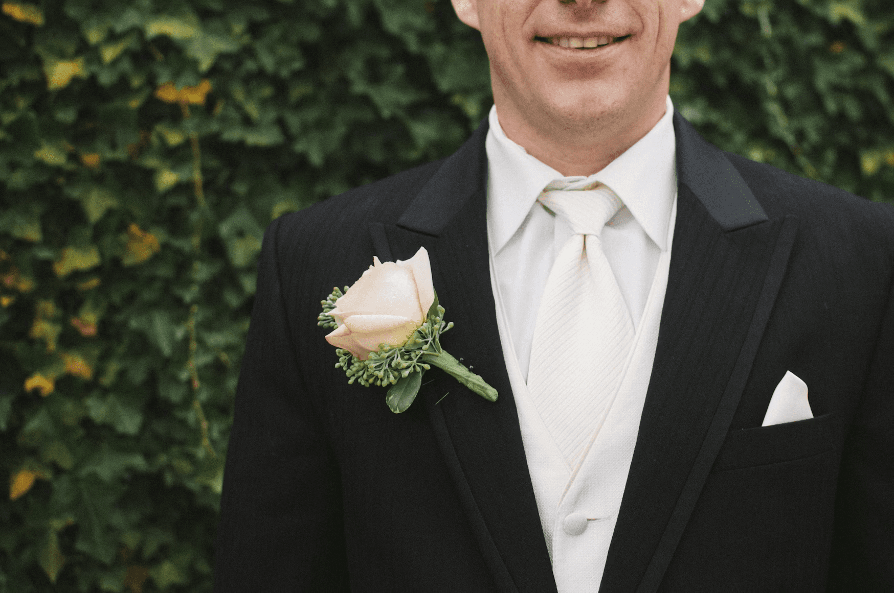 groom wearing black suit
