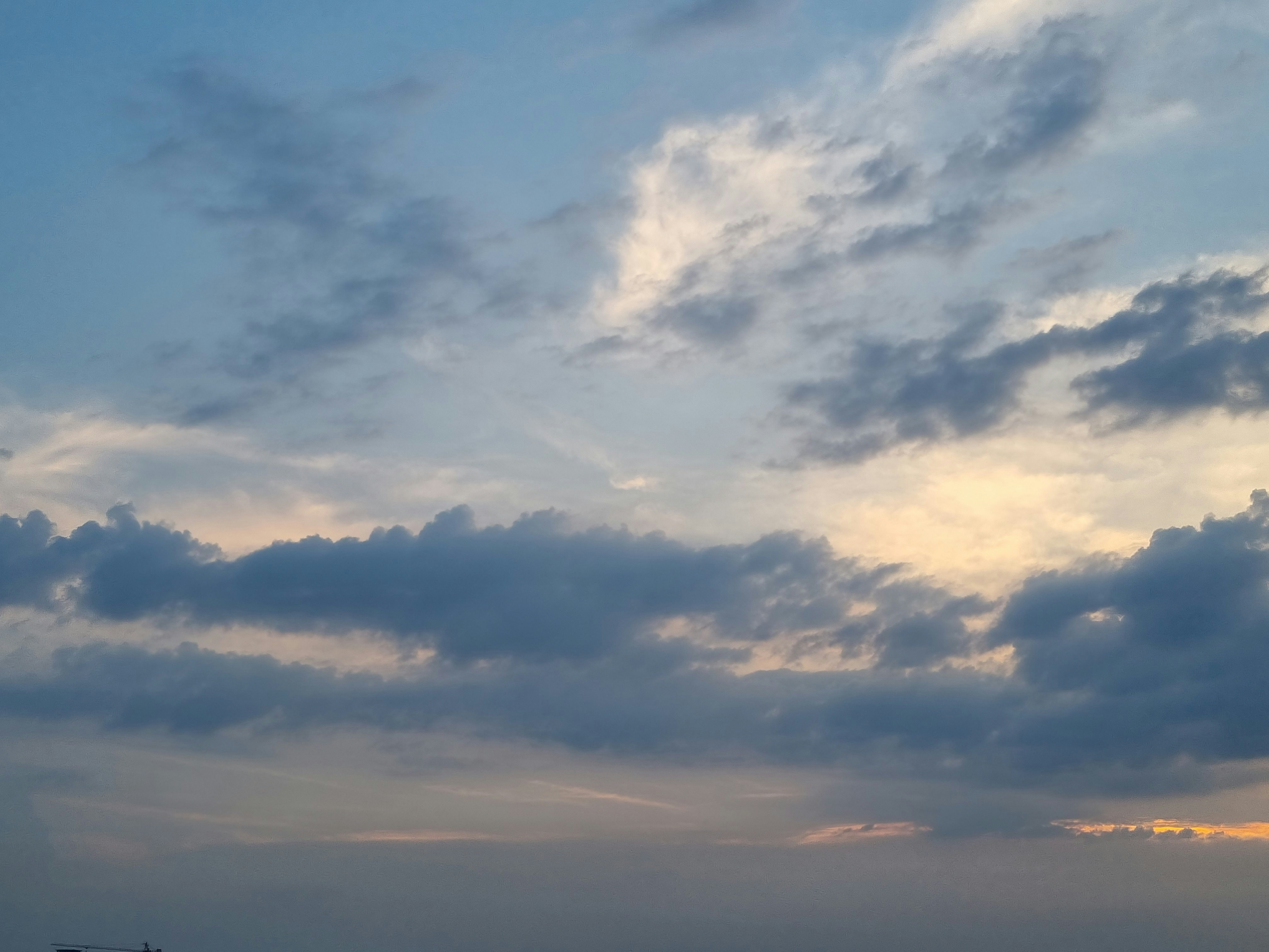 a cloudy sky with light clouds