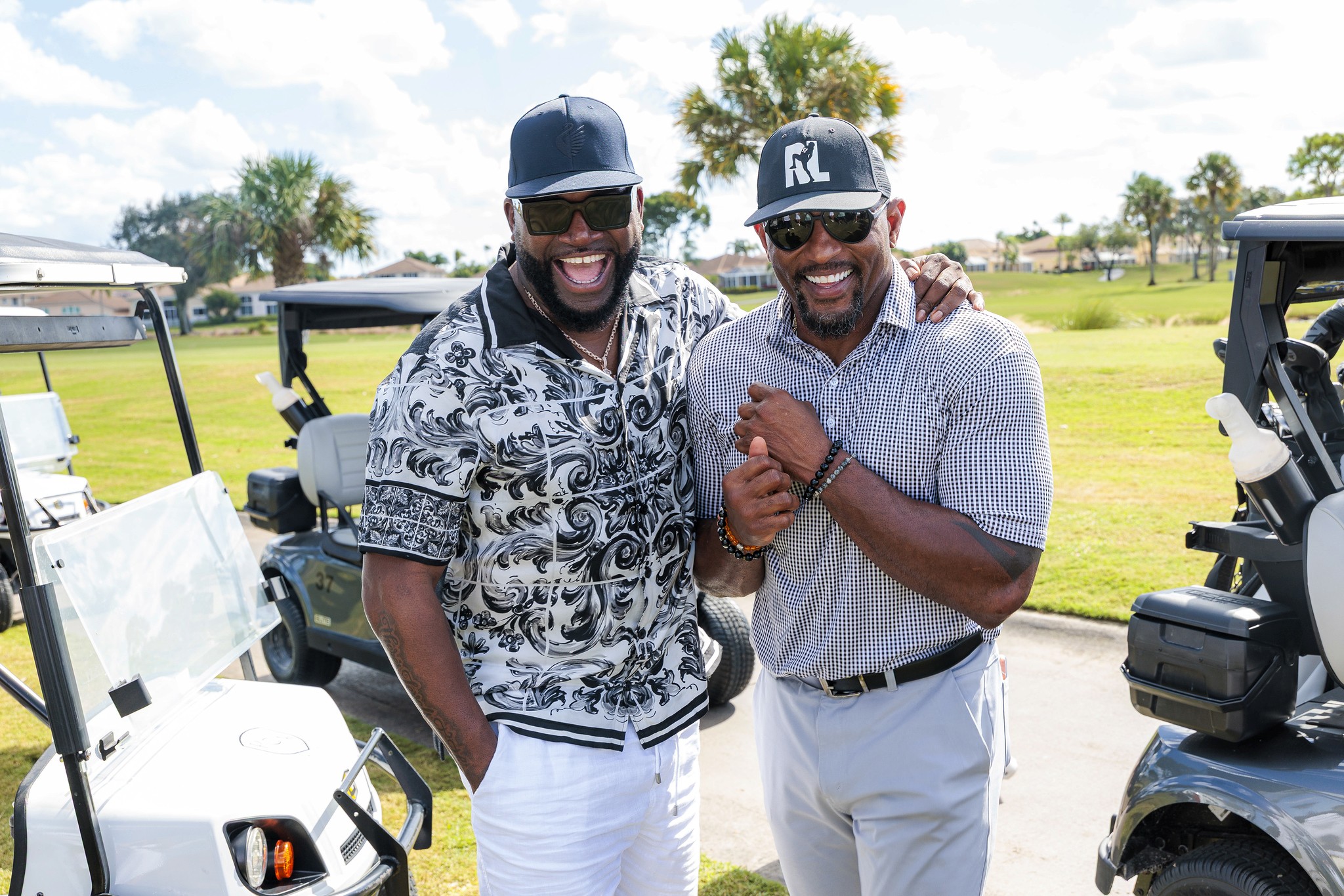 David Ortiz with a guest on the course