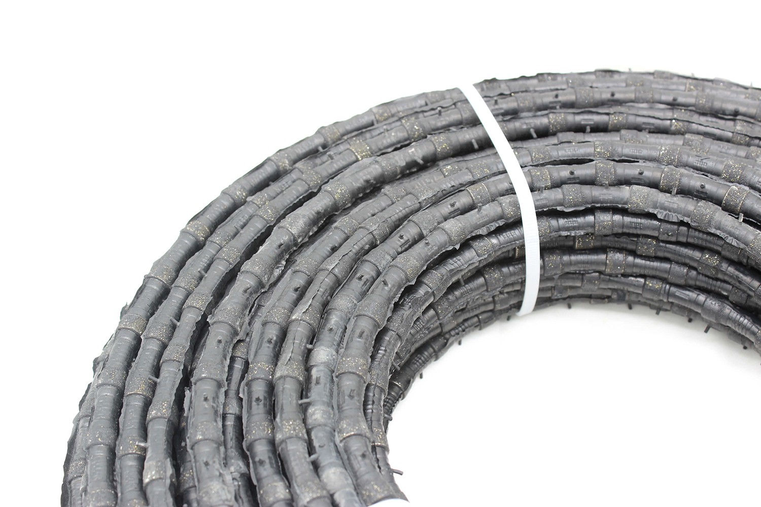 Detailed shot of the Diamond Wire Saw segments, highlighting the high-quality construction and cutting efficiency.