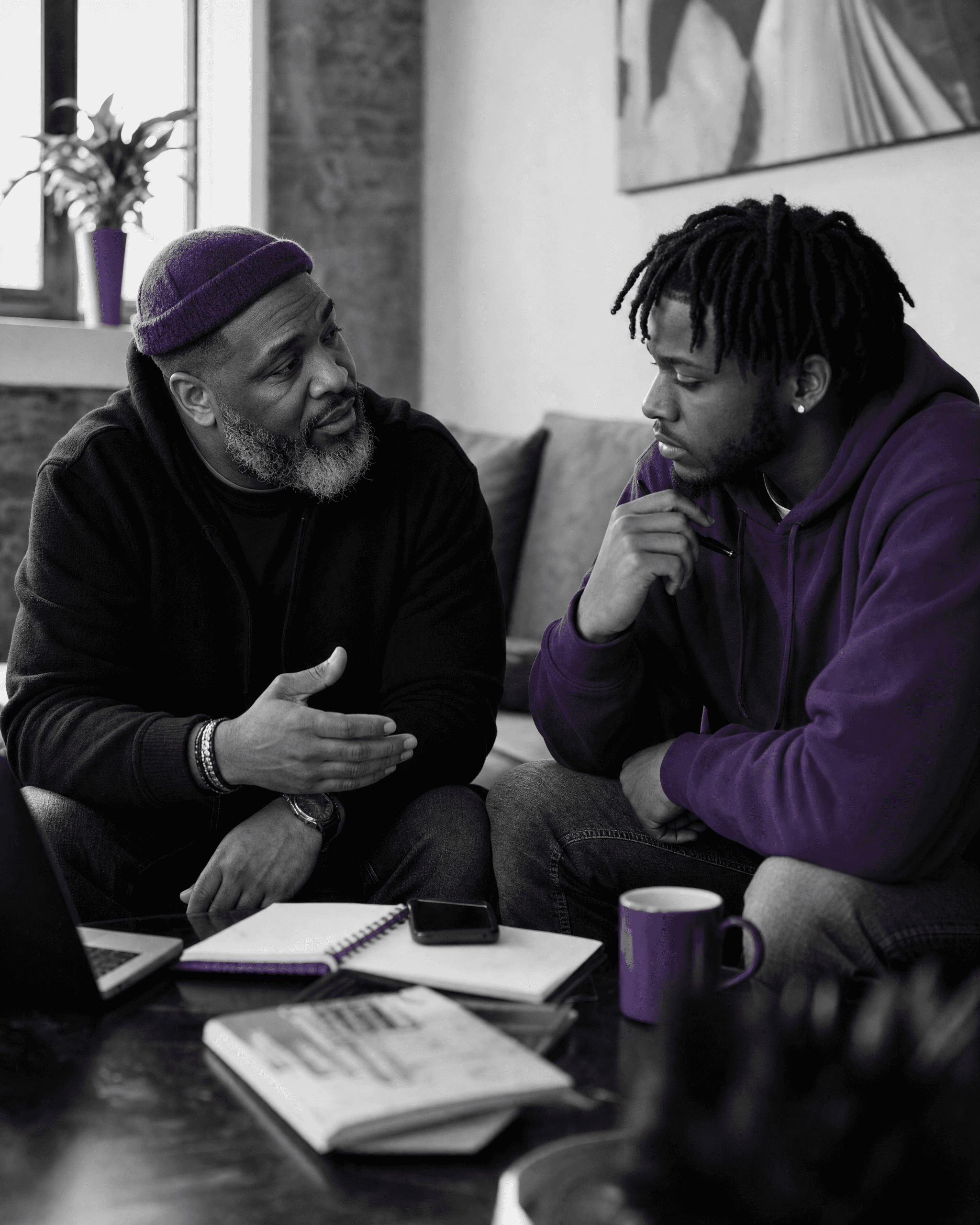 Participant discussing practical life goals with a community mentor.