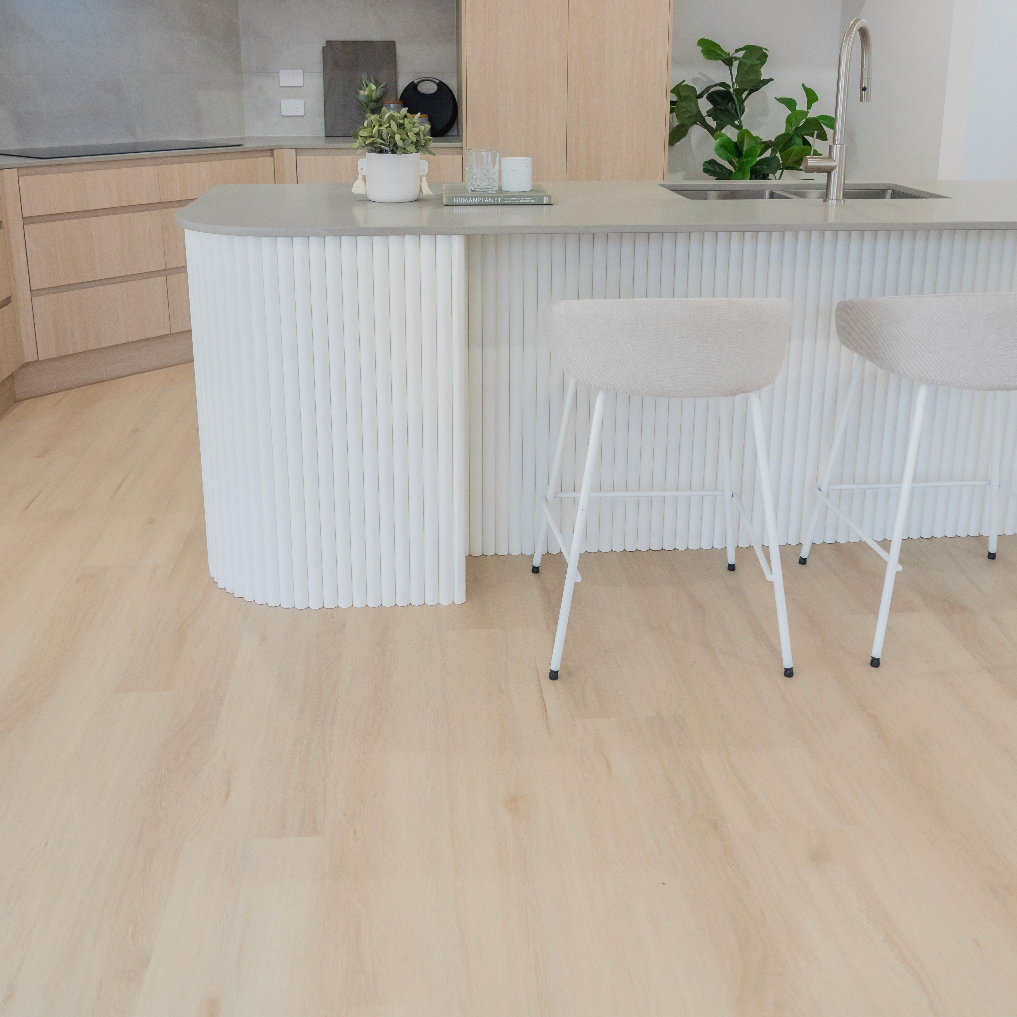 Hybrid flooring in a Brisbane kitchen, designed for water resistance and slip protection in busy cooking areas.