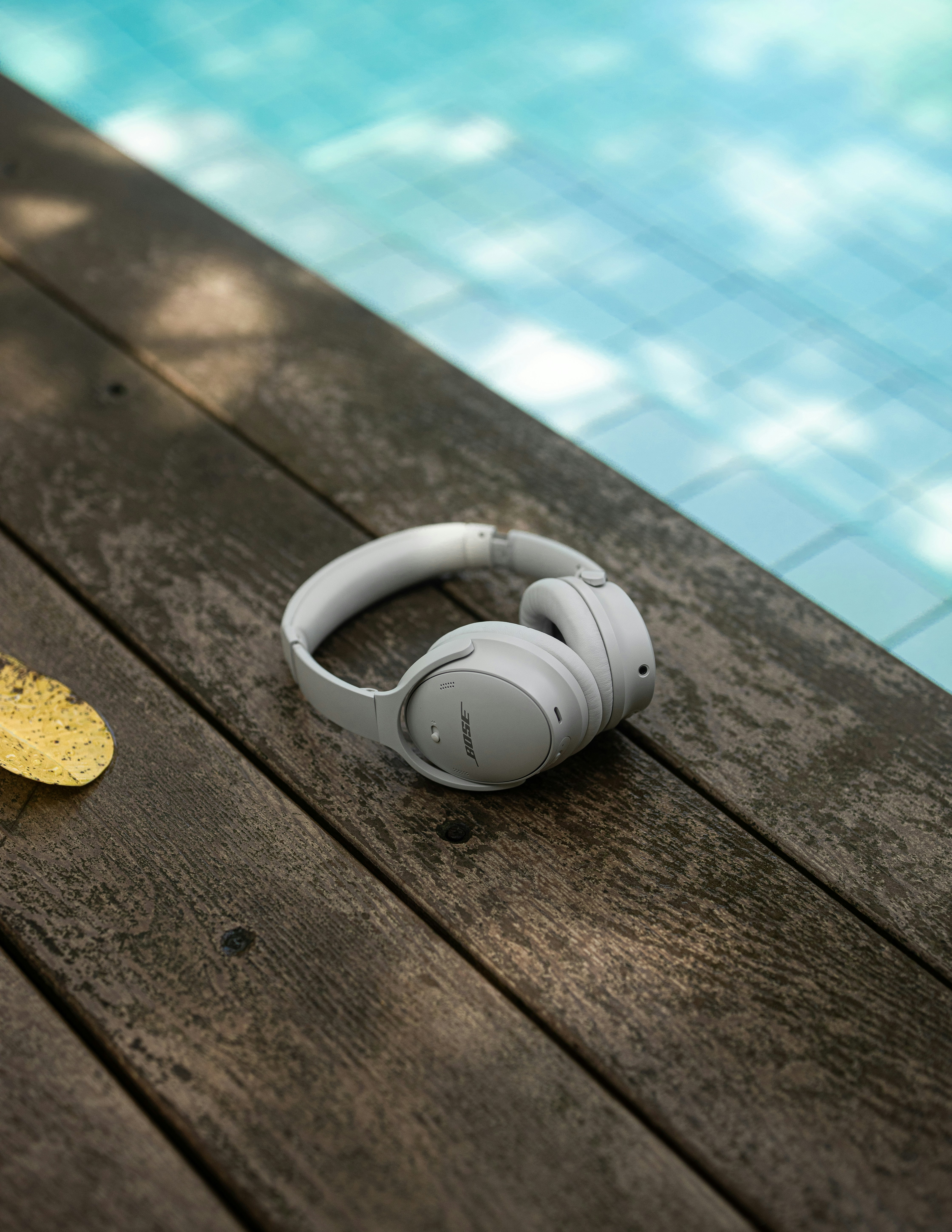 Bose headphones by a pool