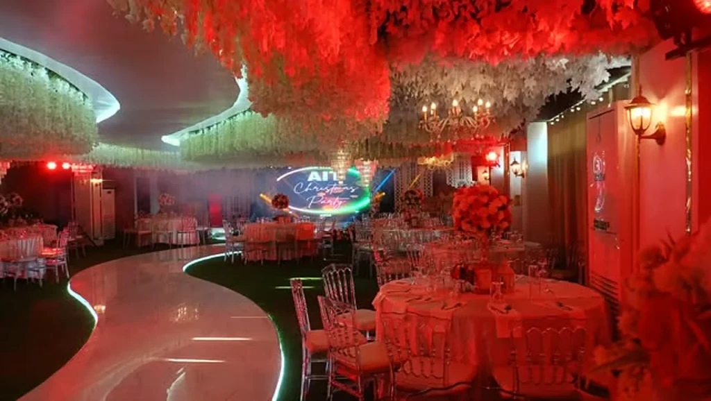 Corporate event with LED wall staging in warm red lighting inside Celestia Hall at Stalla Suites Events Place, Quezon City