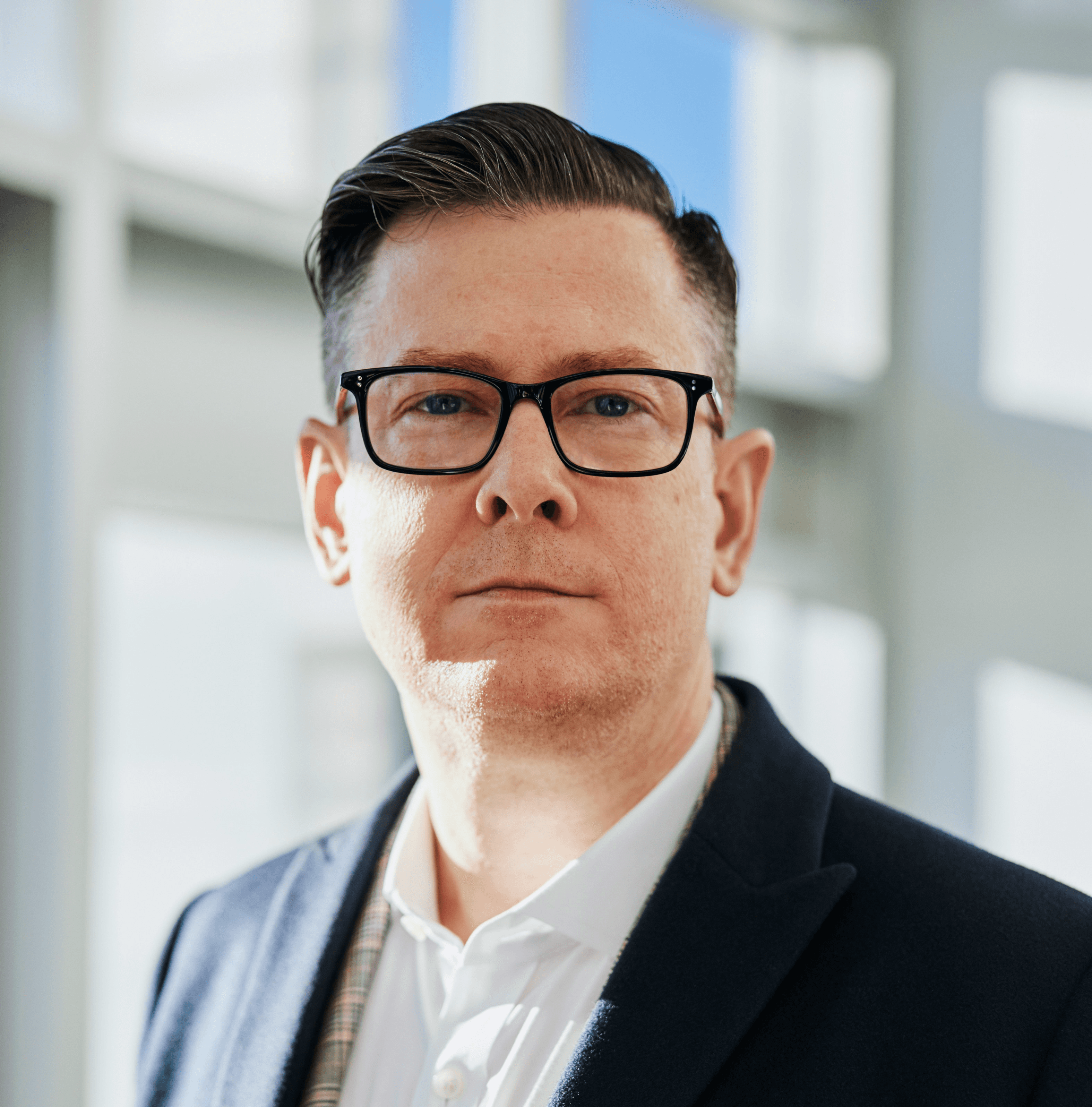 man standing beside wall