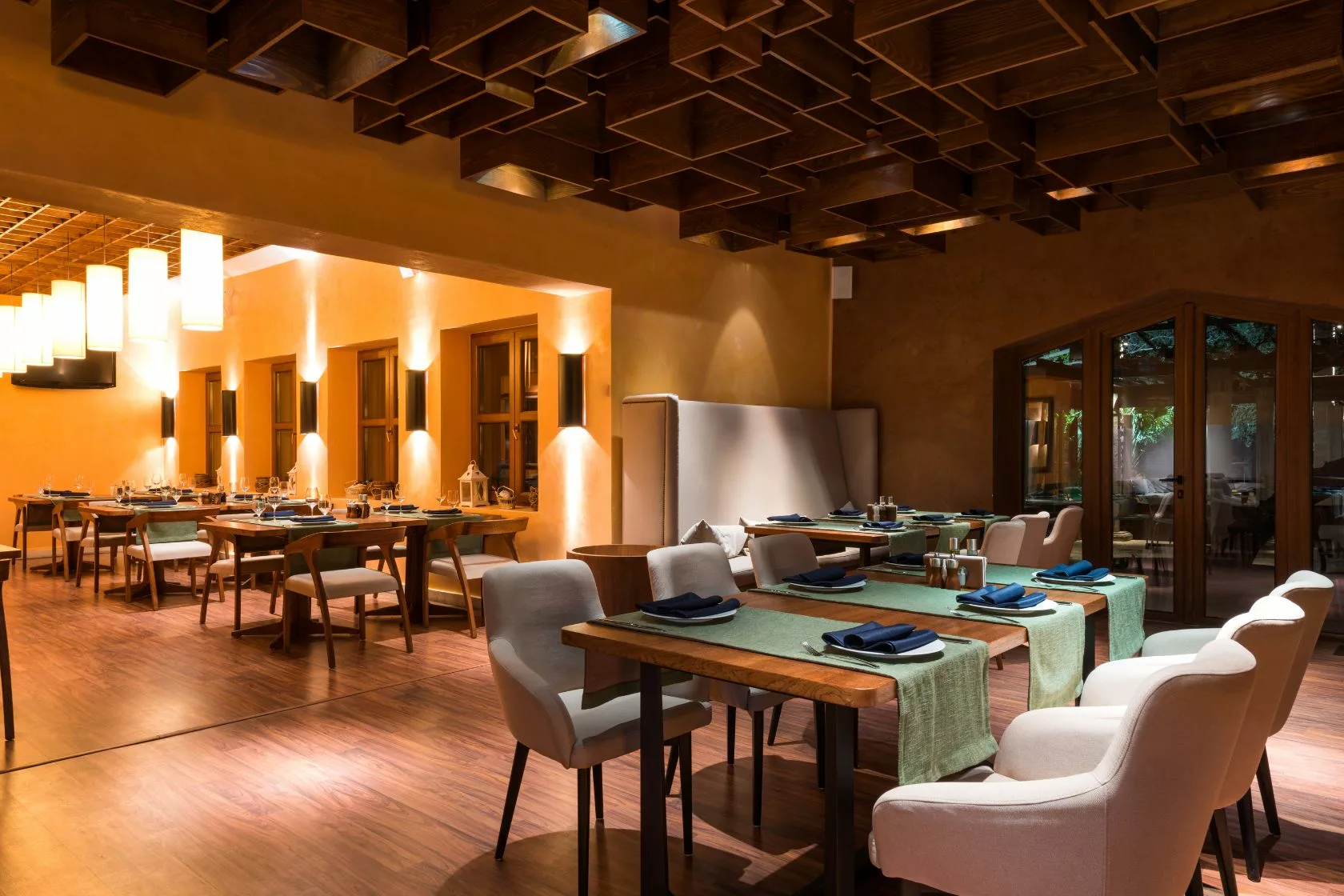 a man and a woman shaking hands in front of a laptop