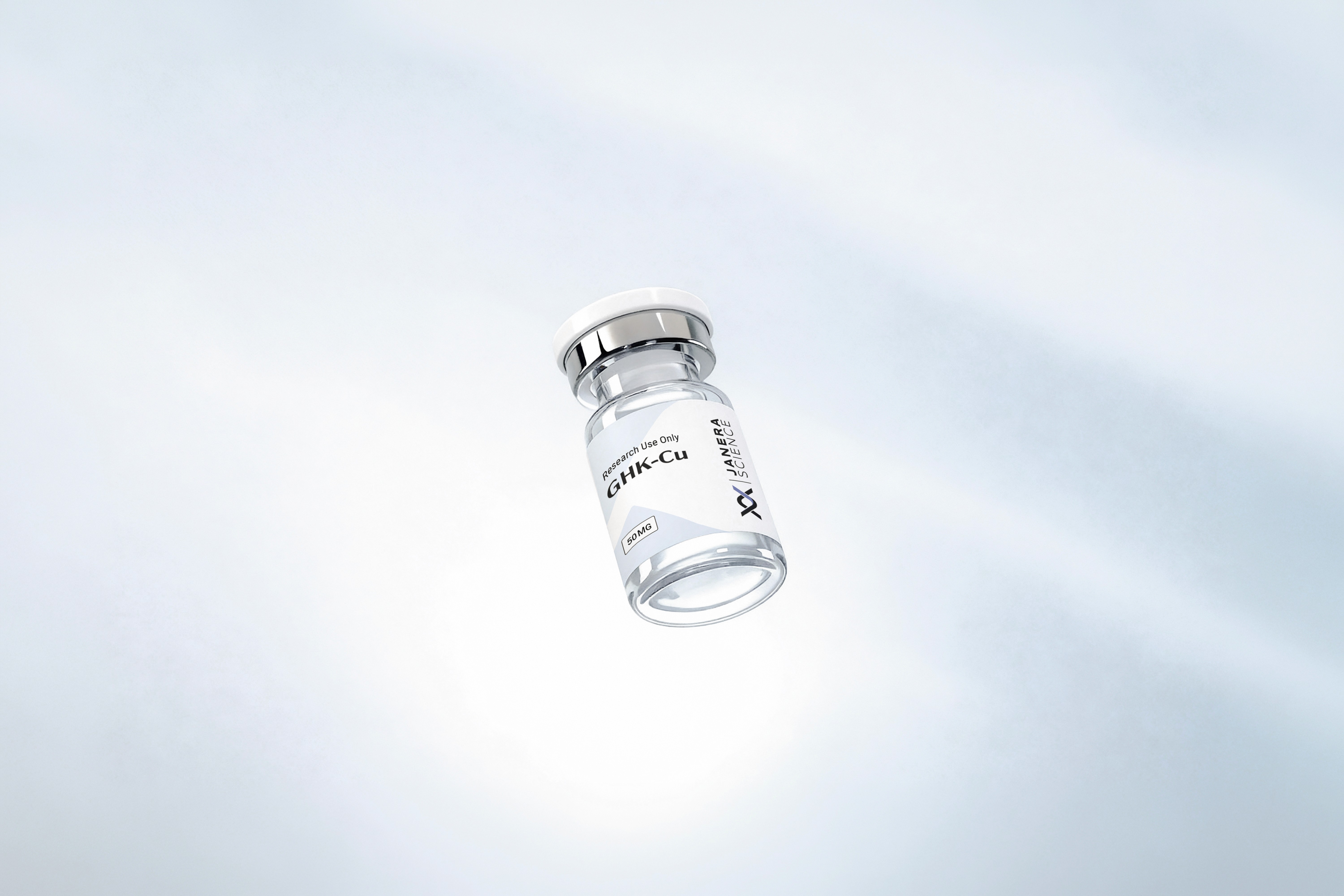 Single Janera Science GHK-Cu 10mg research peptide vial with white stopper and chrome crimp cap, floating against a soft light gray gradient background. For laboratory research use only.