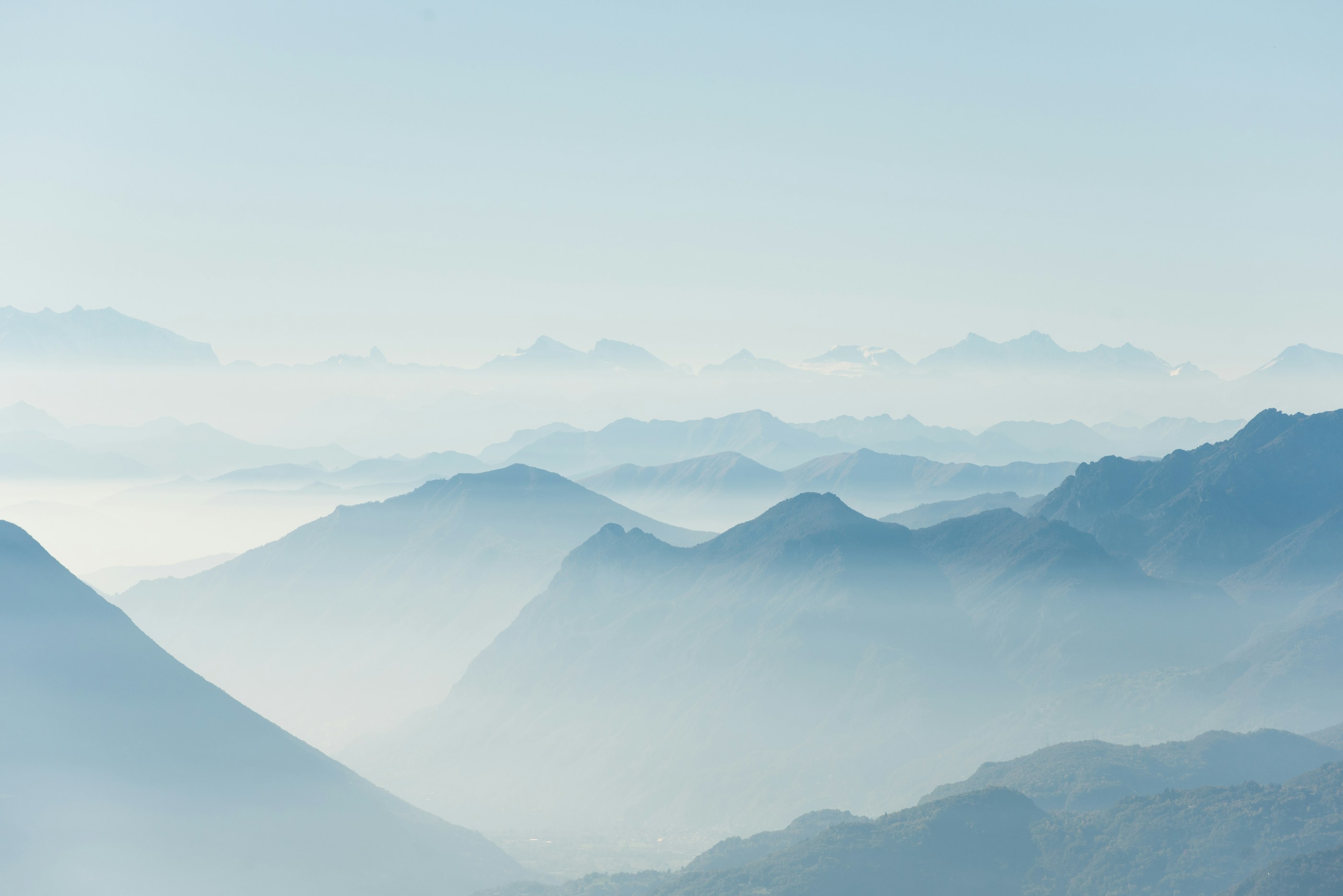 Blue mountain ridges in morning fog