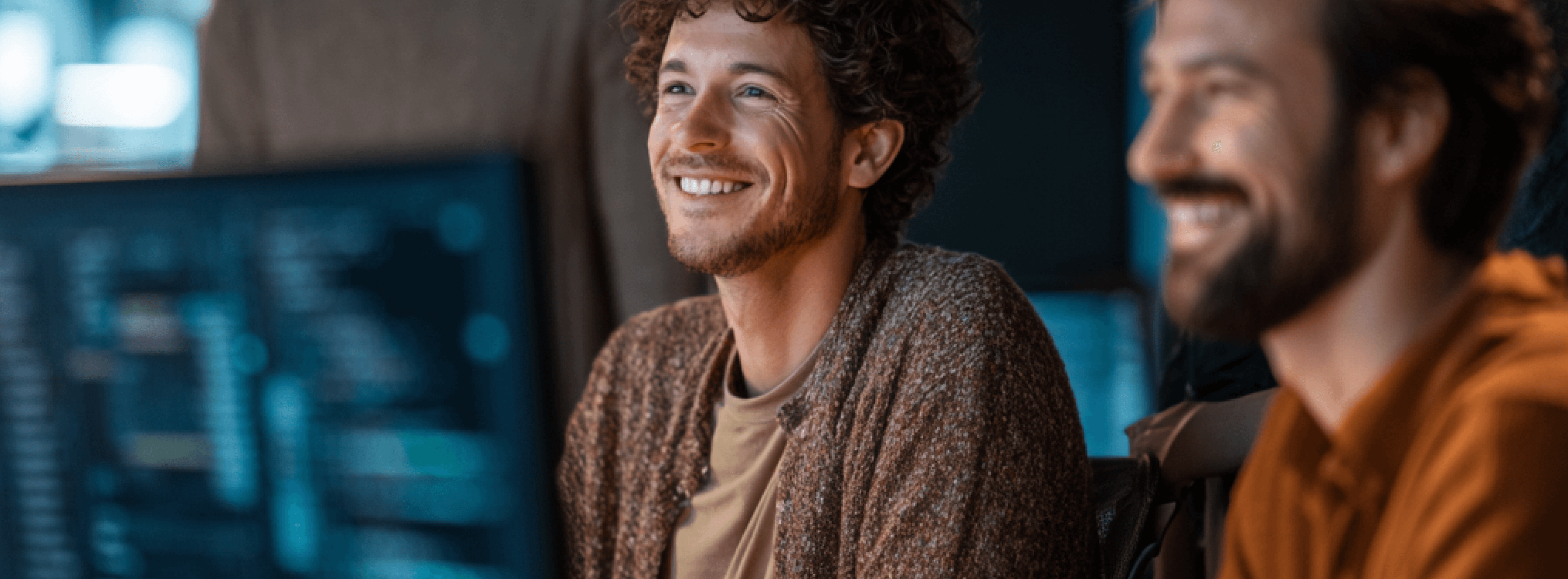 Two people looking at a screen