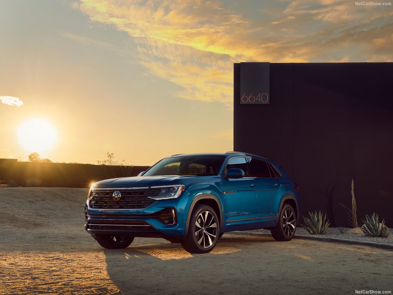 Volkswagen Atlas Cross Sport parked outdoors at sunset with dramatic lighting