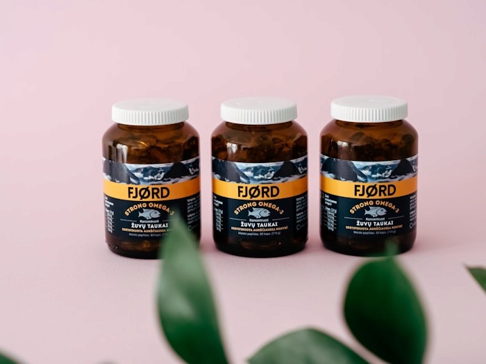 Amber supplement bottles on a clean studio background
