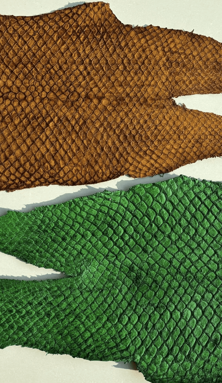 two ladies looking at a laptop and smiling