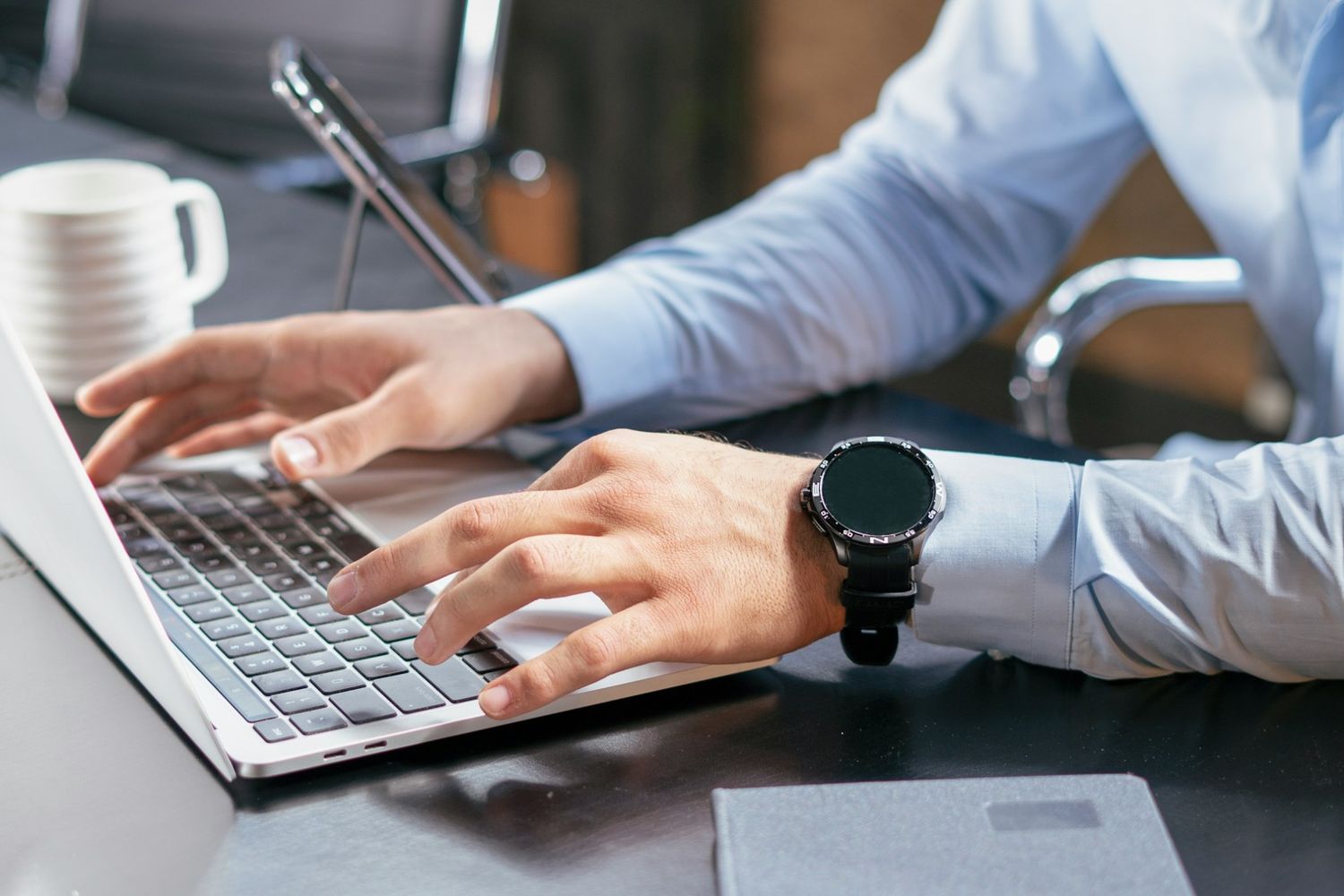 A man with his laptop using an Best Invoice Parsing Software