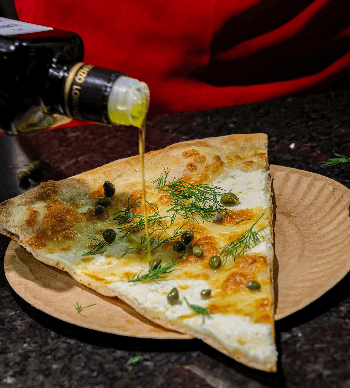 A delicious spread featuring a thin crust round pizza and a thick crust square Sicilian pizza