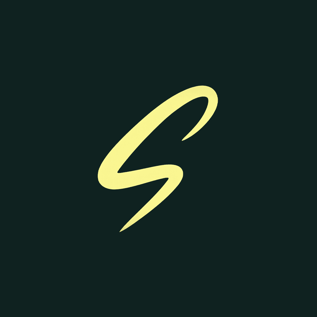 woman staring directly at camera near pink wall