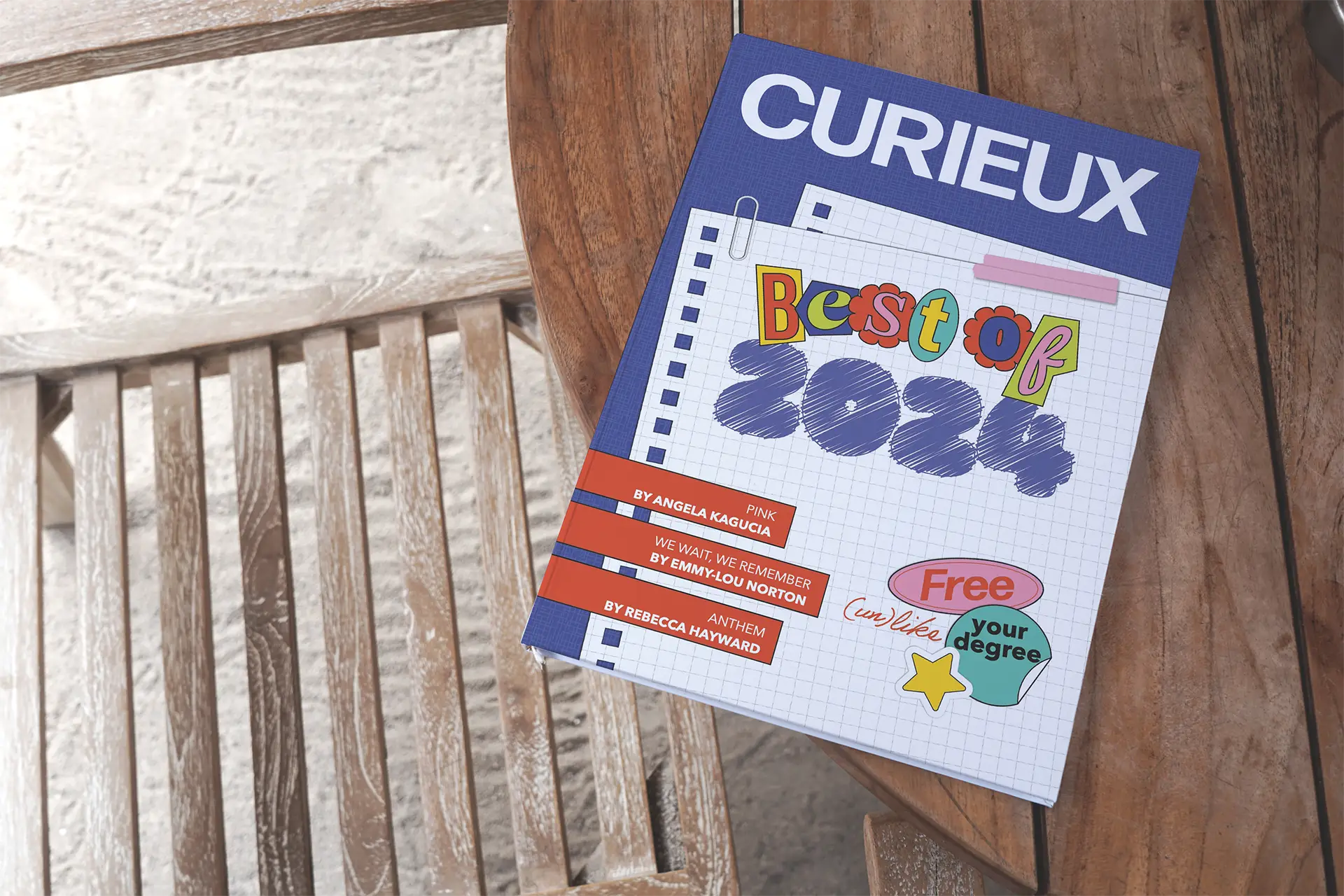 Curieux Best of 2024 magazine cover on a wooden bench